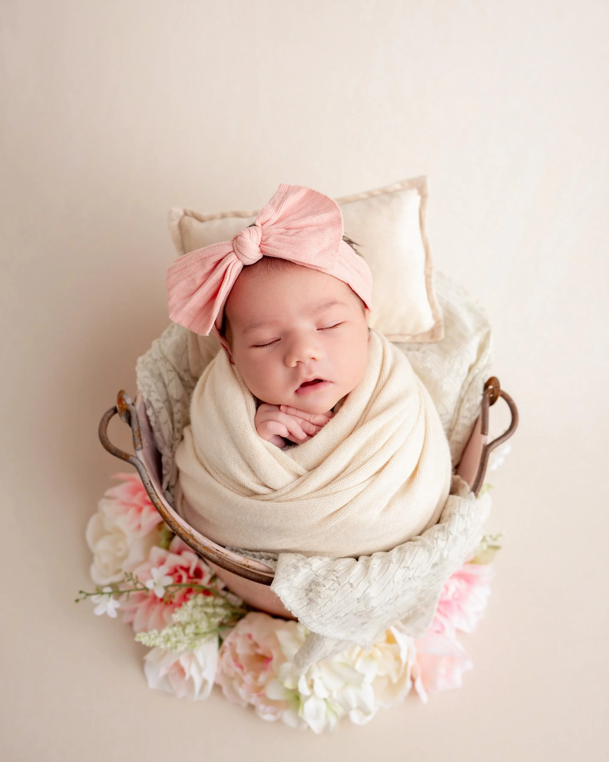 This sweet girl was the PERFECT little model! She slept like a dream through every pose and setup, and made my job so easy.

We kept her session soft and dreamy with blush pinks, delicate florals, and pops of light green. I&rsquo;m completely in love