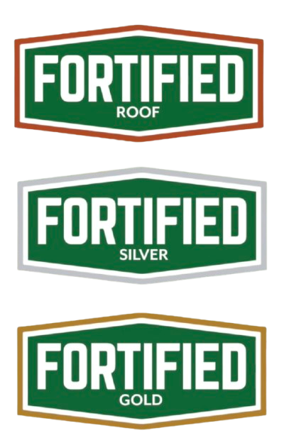 Three logos for Fortified roofing, in gold, silver, and bronze colors with the word 'FORTIFIED' in bold white letters. The gold logo has the word 'GOLD' underneath, the silver logo has 'SILVER', and the bronze logo has 'ROOF'.