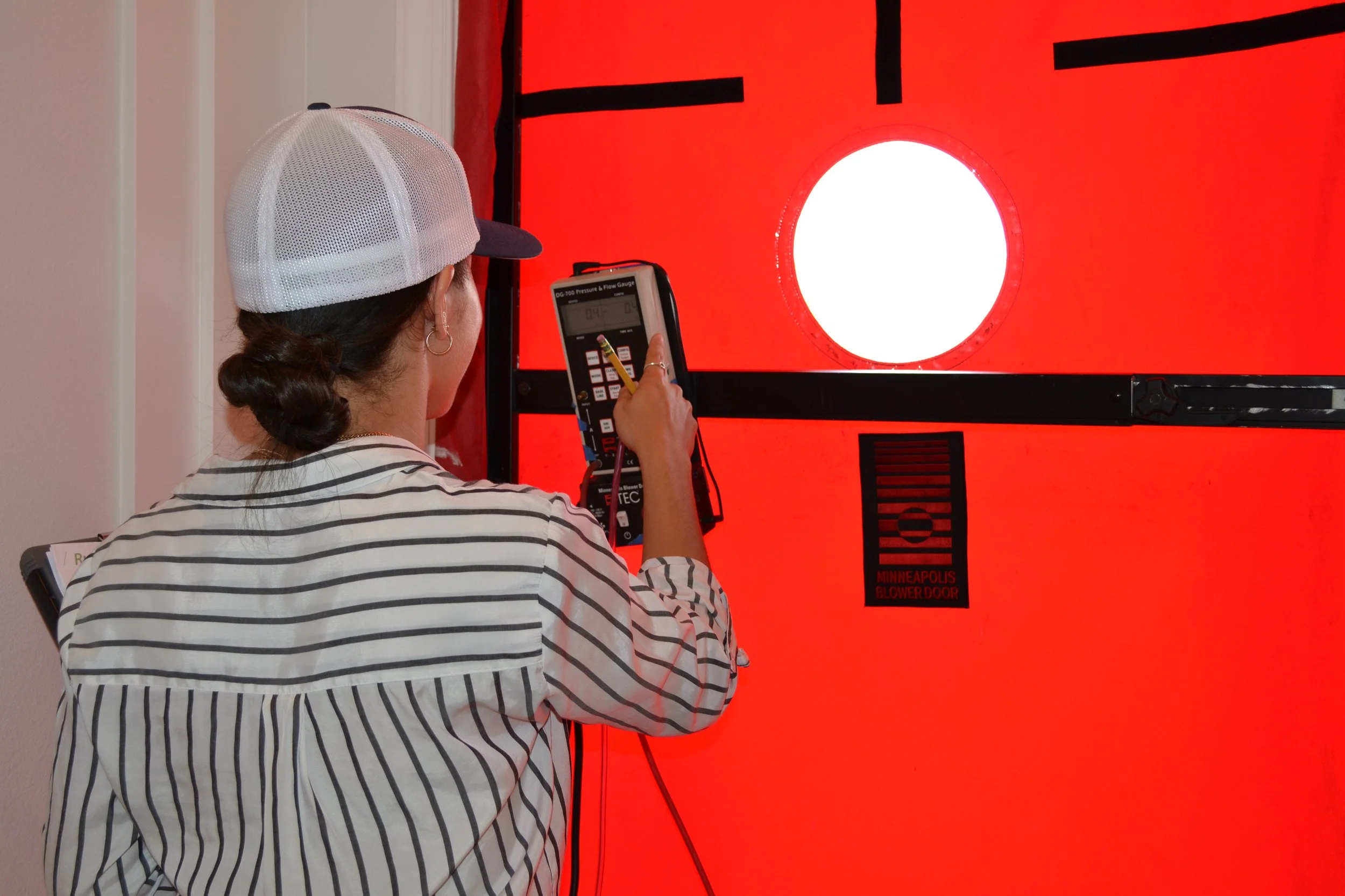 Our intern learning blower door testing