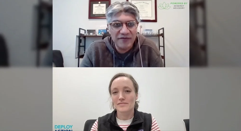 A man and a woman in a video call. The man has gray hair and glasses, and the woman has light brown hair. Both are sitting in offices with certificates on the wall behind them.
