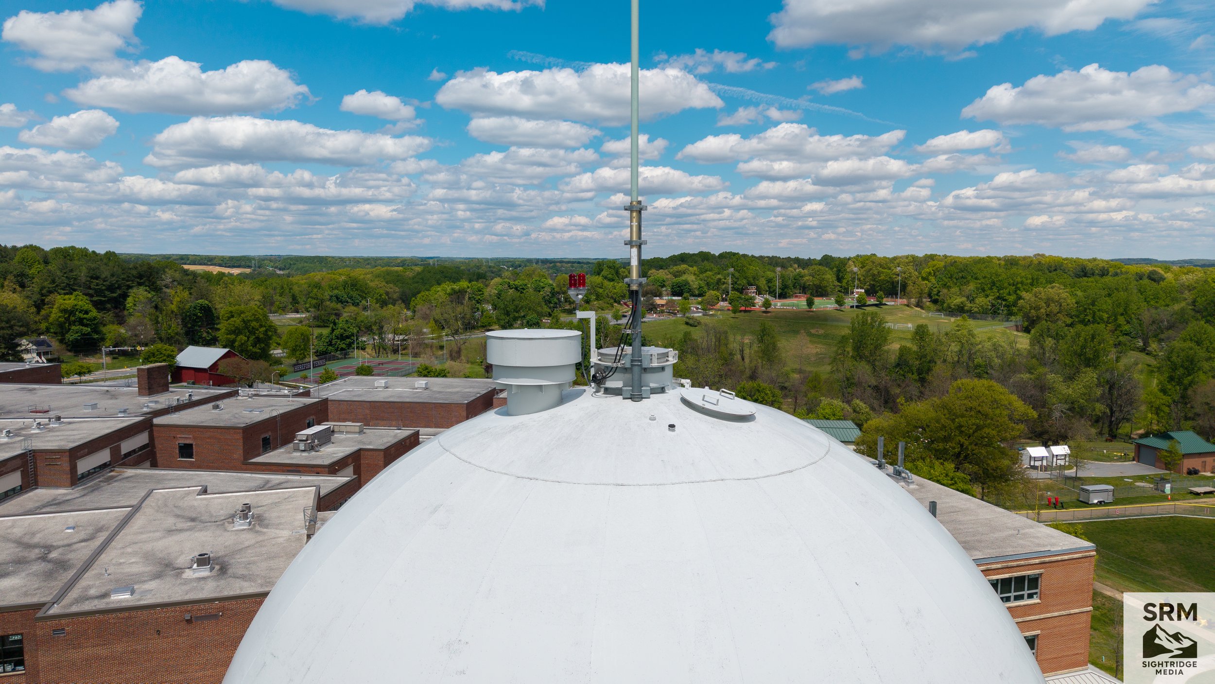 Water Tower Dome Documentation — Aerial overview of water tower structure, surface condition, and mounted equipment — Northern Maryland.