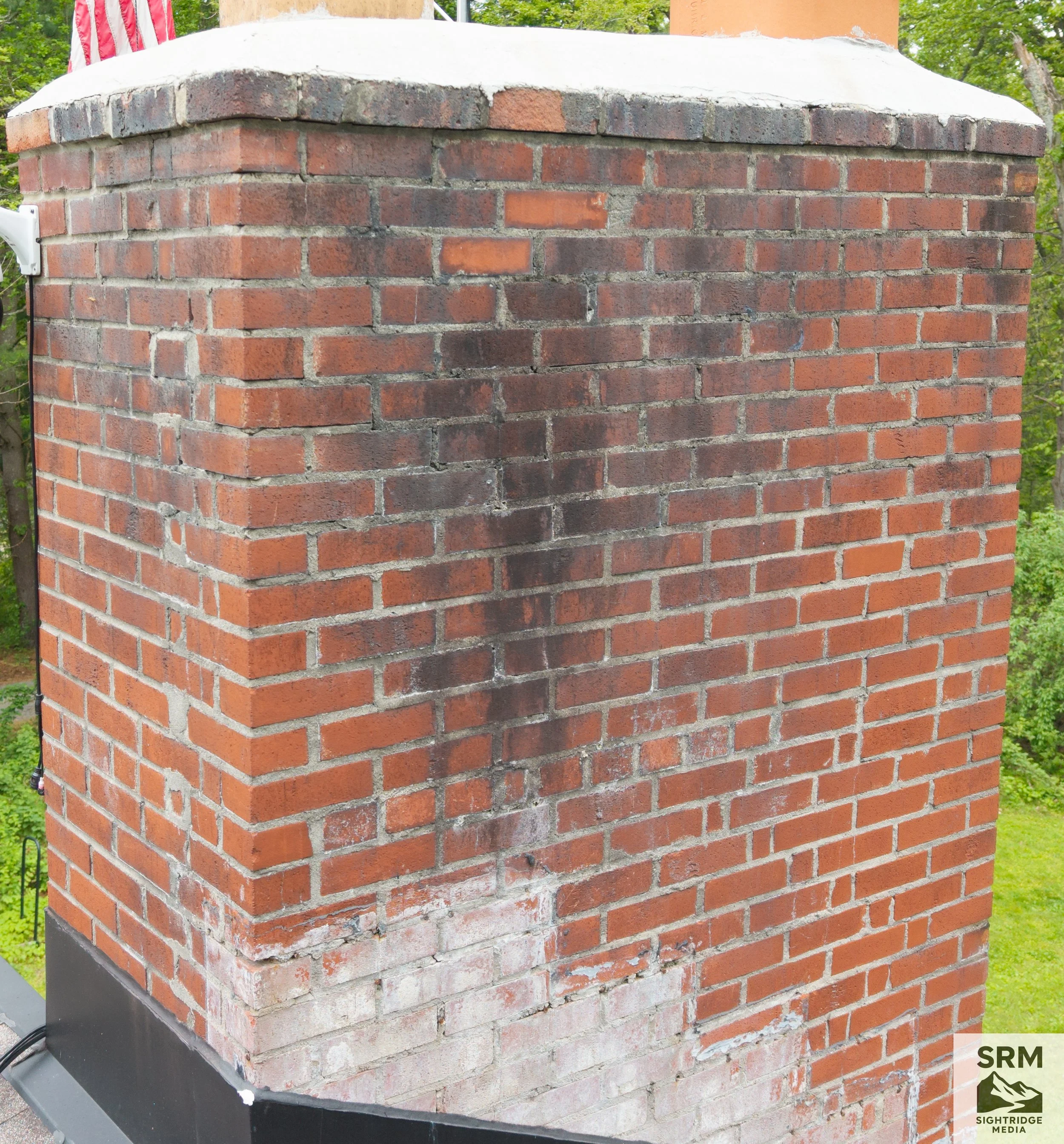 Chimney Documentation - Close-up aerial detail showing cap, mortar joints, flashing, and crown condition — no ladder required
