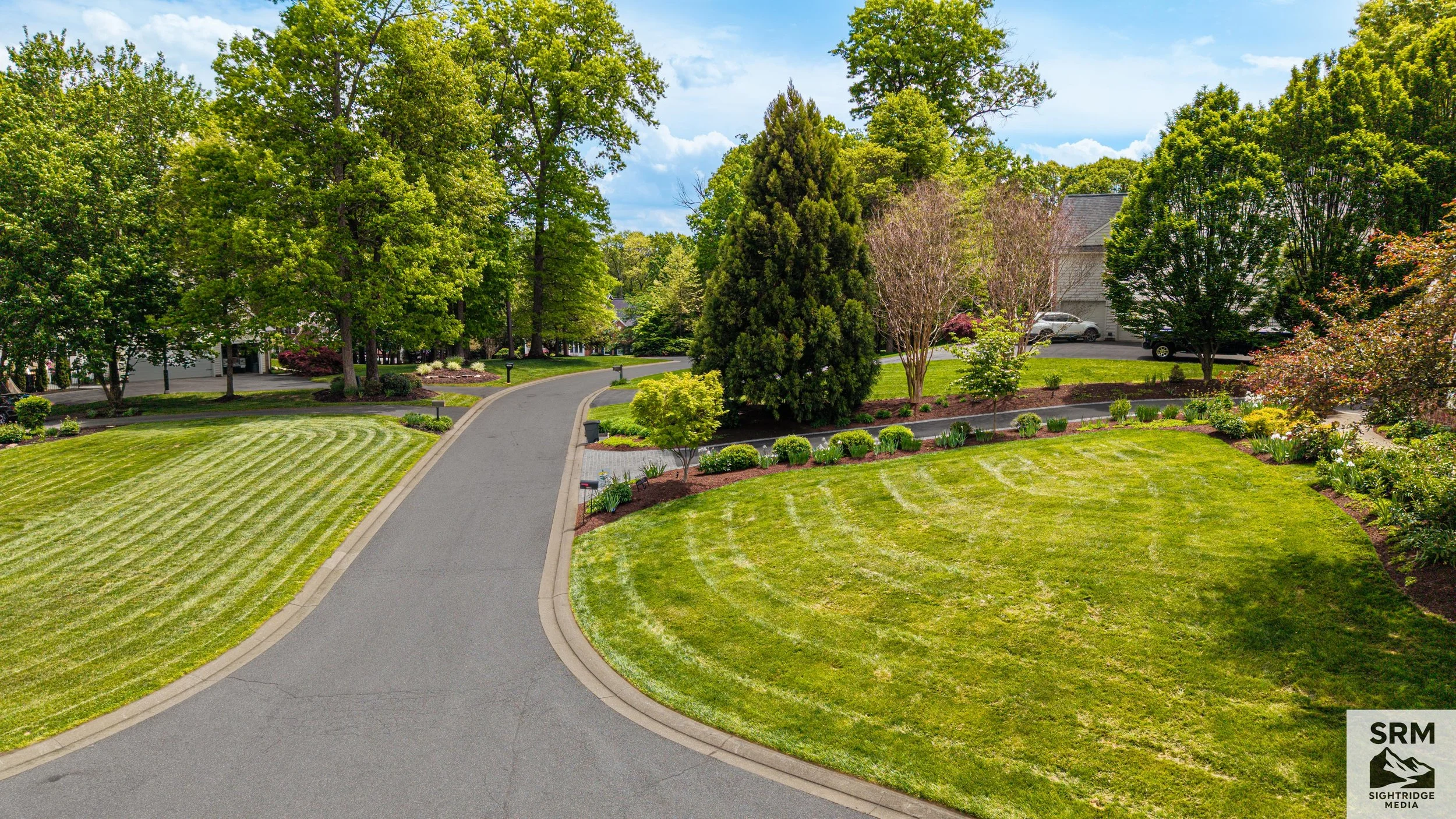 Property Overview — Mid-range aerial showing lot boundaries, landscaping, and driveway approach — Parkton, MD.