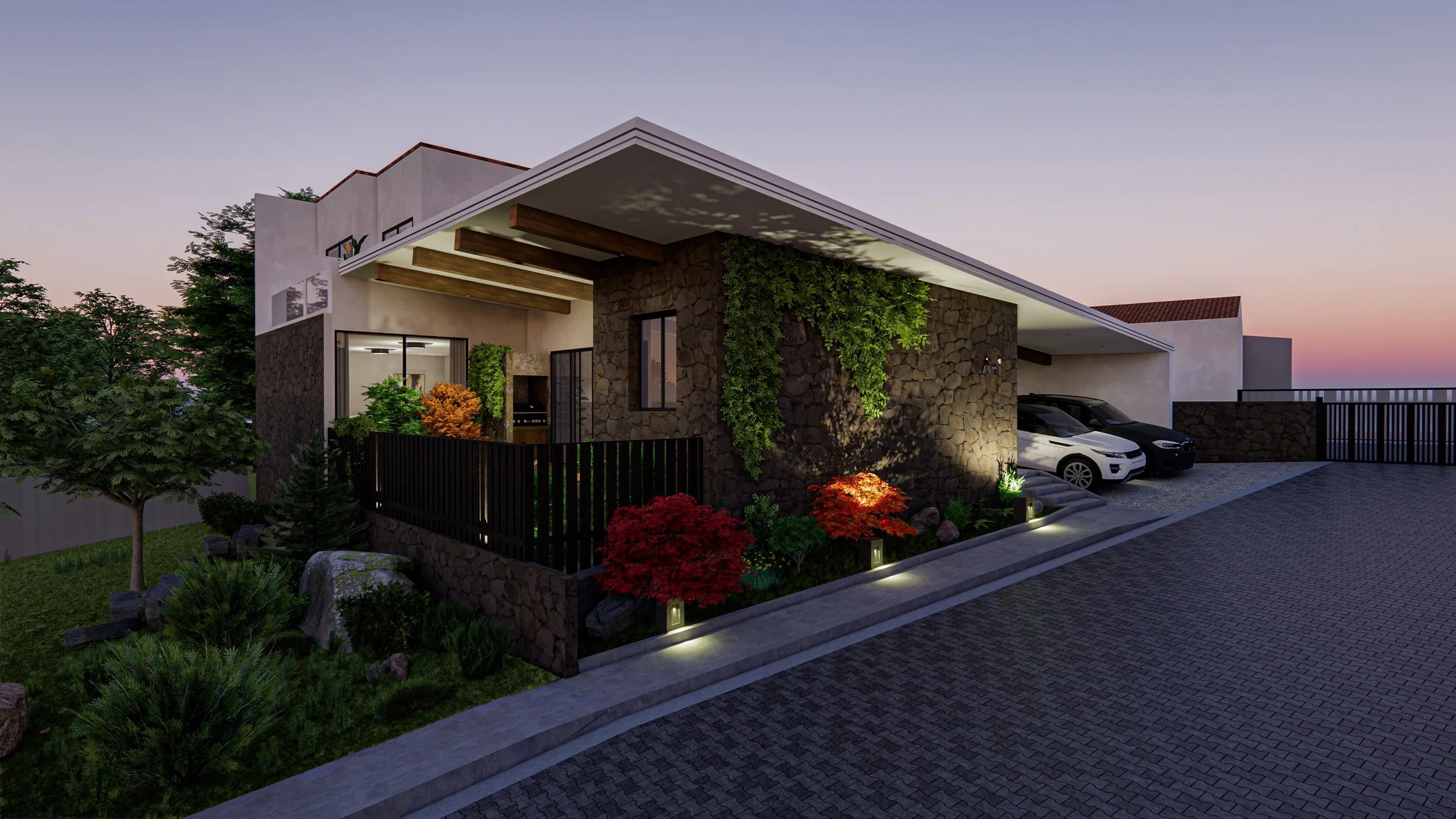 Modern house with stone and stucco exterior, landscaped garden with trees and shrubs, driveway with parked cars, and sunset sky in the background.
