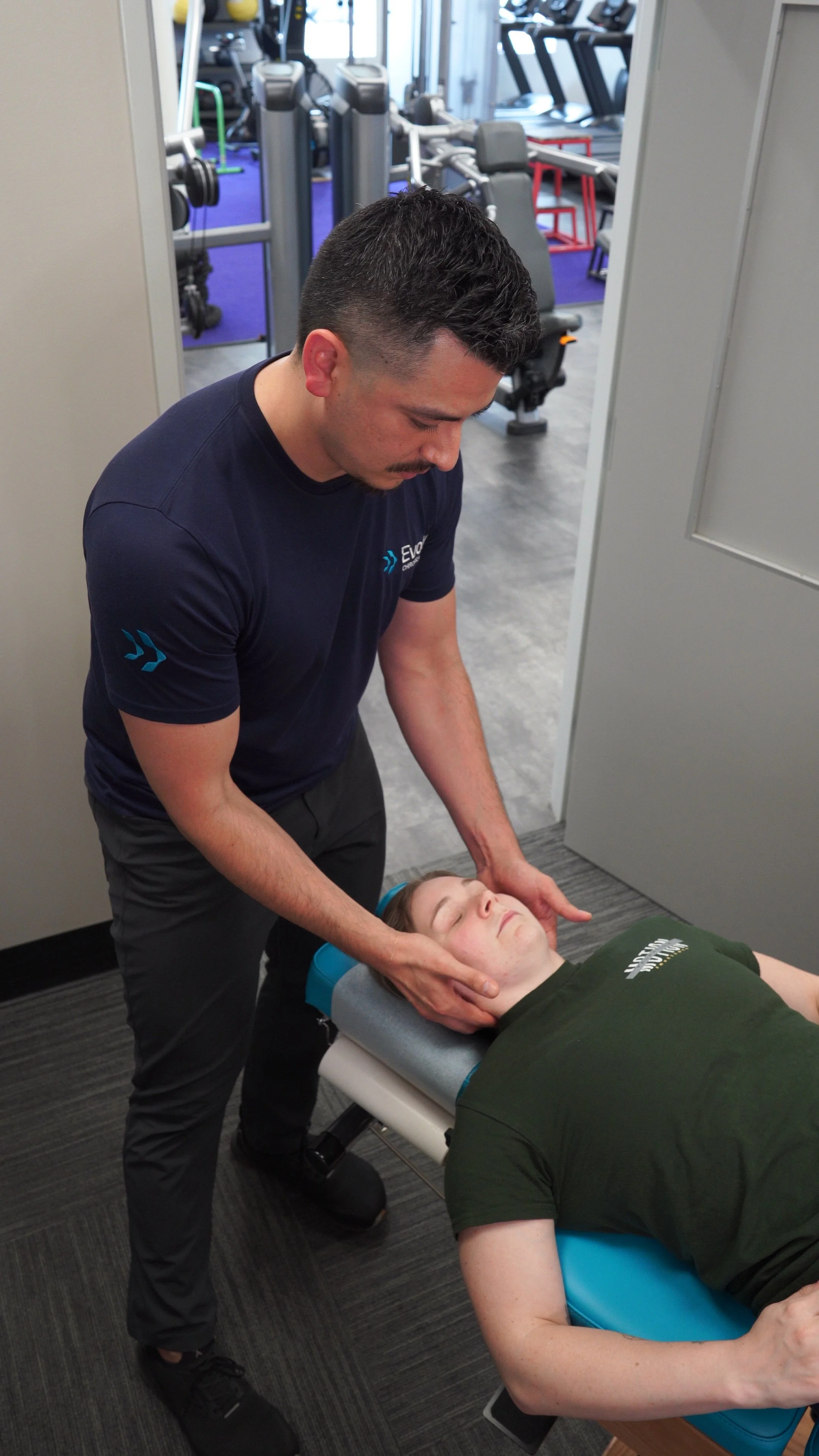 Patient receiving soft tissue therapy at Evolv Chiropractic in Bishop Arts, Dallas