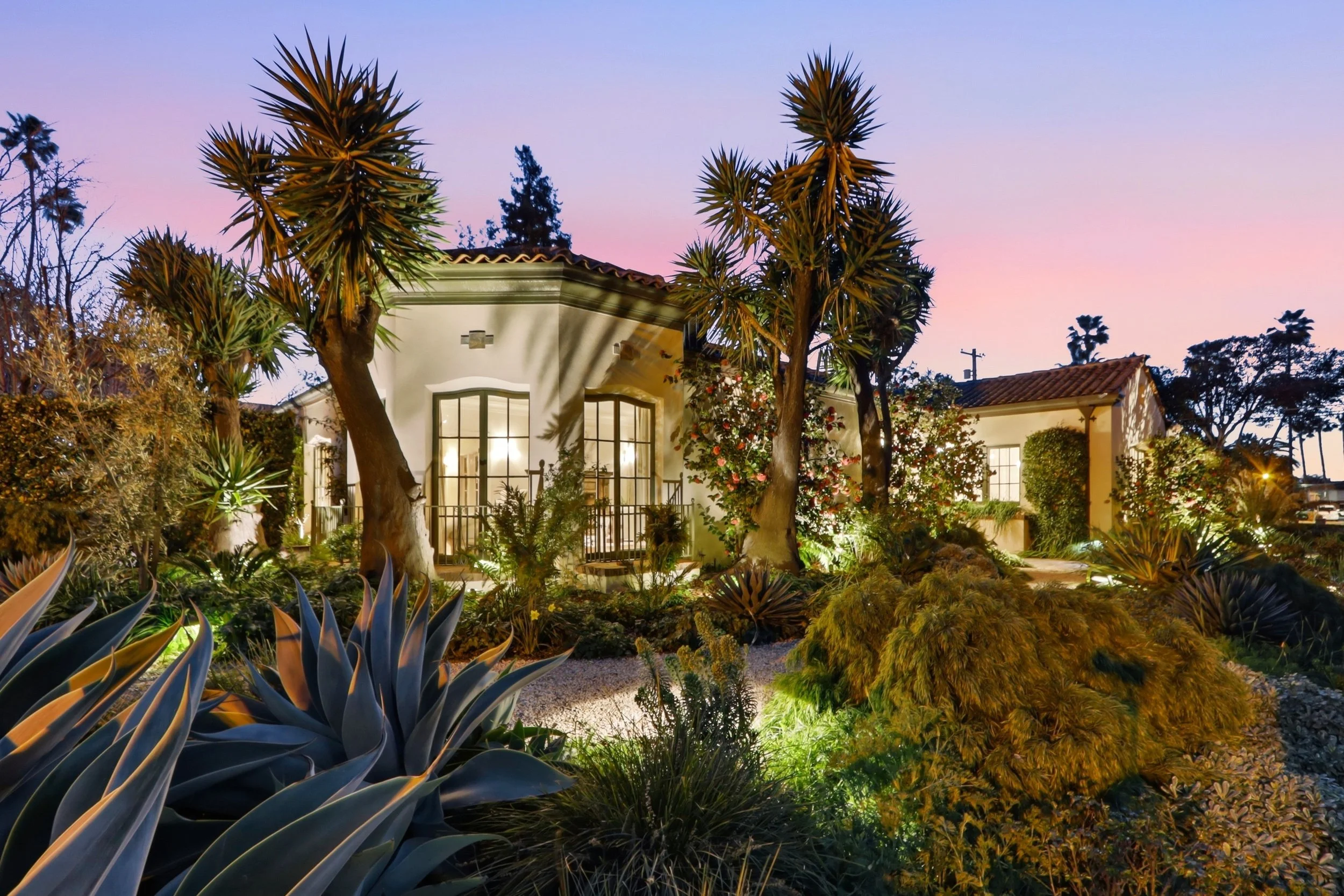 Solid copper pathway and landscape lighting create a warm and inviting ambiance.