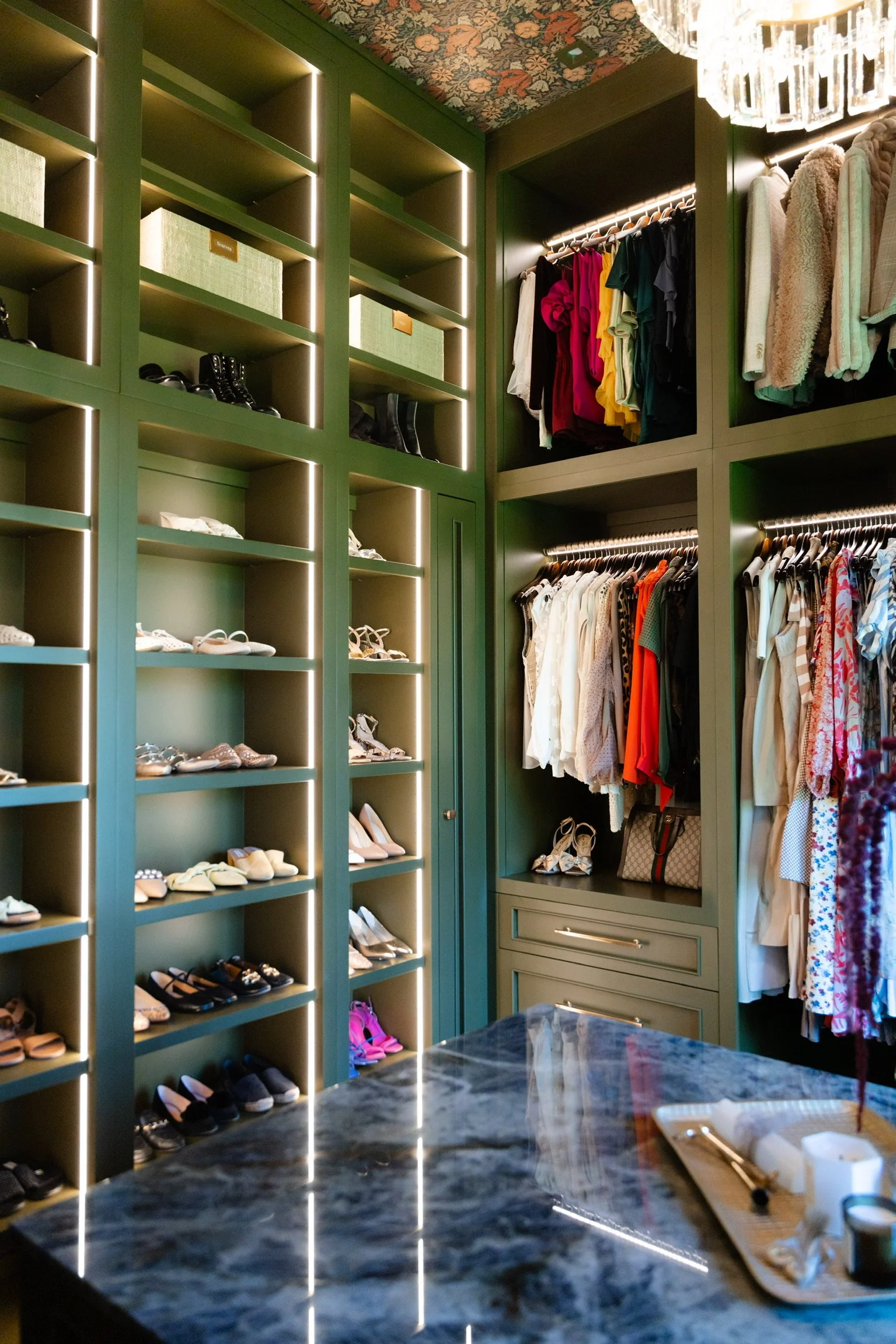 Luxury walk-in closet organization with dark wood shelving — white glove home organization, North Atlanta.