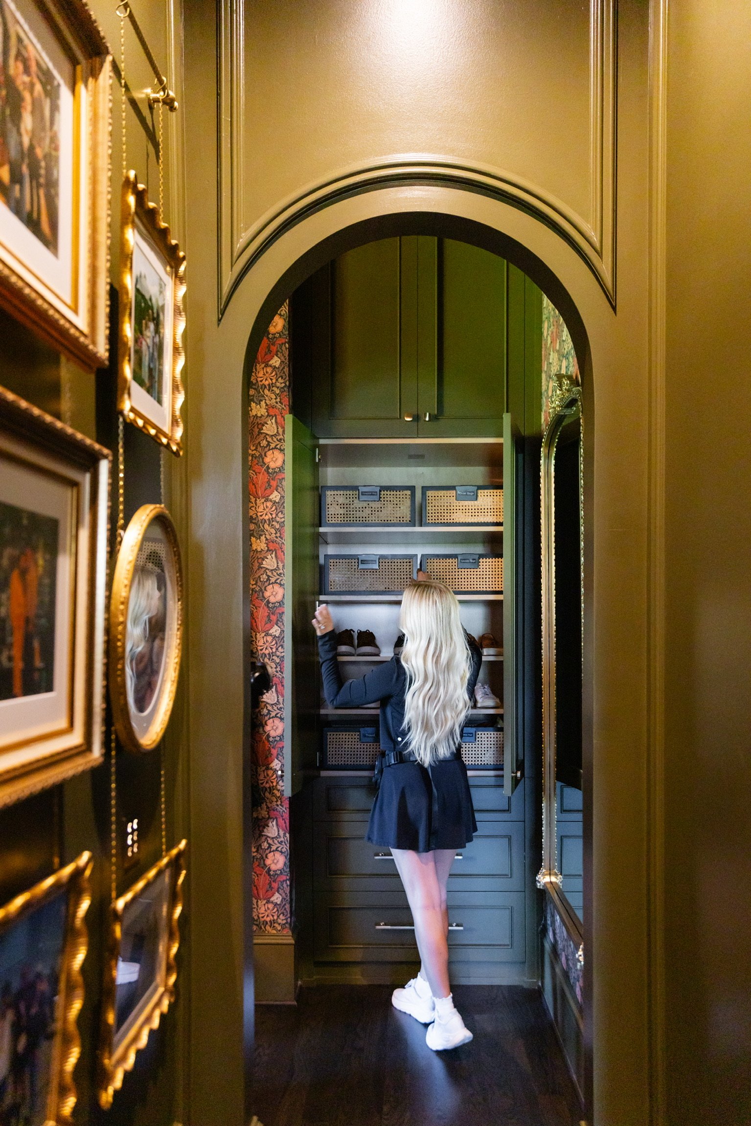 Alexis Coffman organizing a master closet at a home in Alpharetta, Georgia.