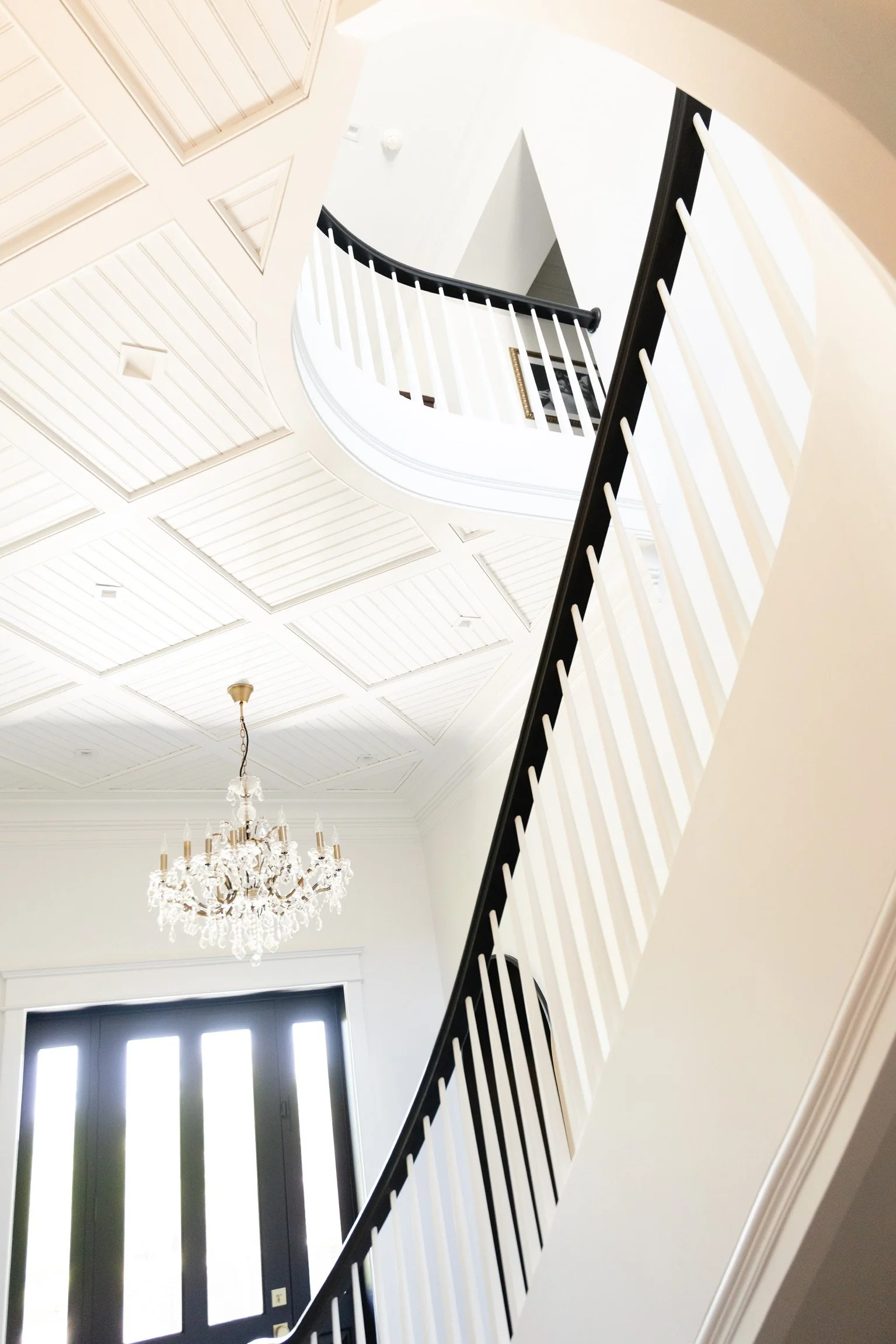 Entryway staircase in an organized North Atlanta home — Arranged by Alexis