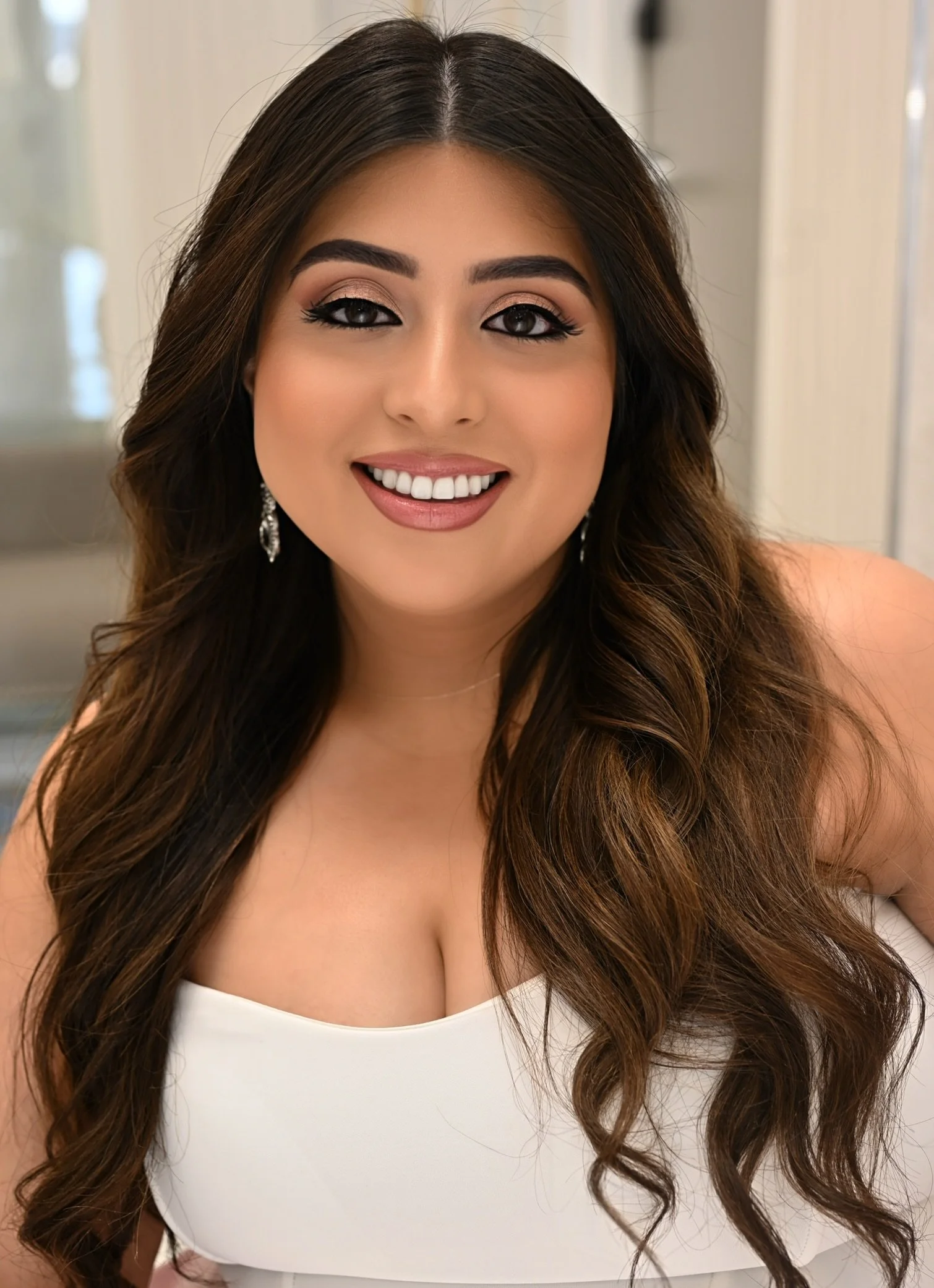 Bride with soft, elevated glam featuring natural skin and refined details, representing the qualities of a luxury bridal makeup artist.