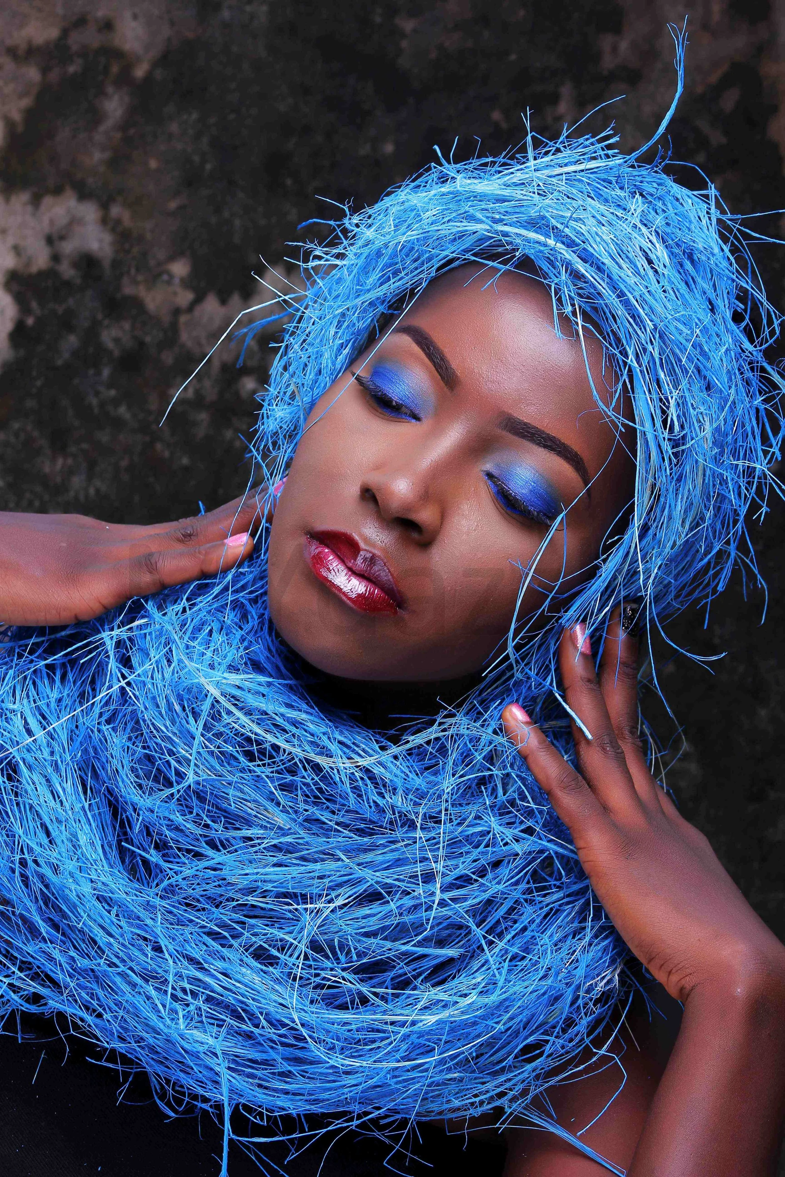 Editorial makeup with defined eyes and glossy lips by MakeupByTohdazzle