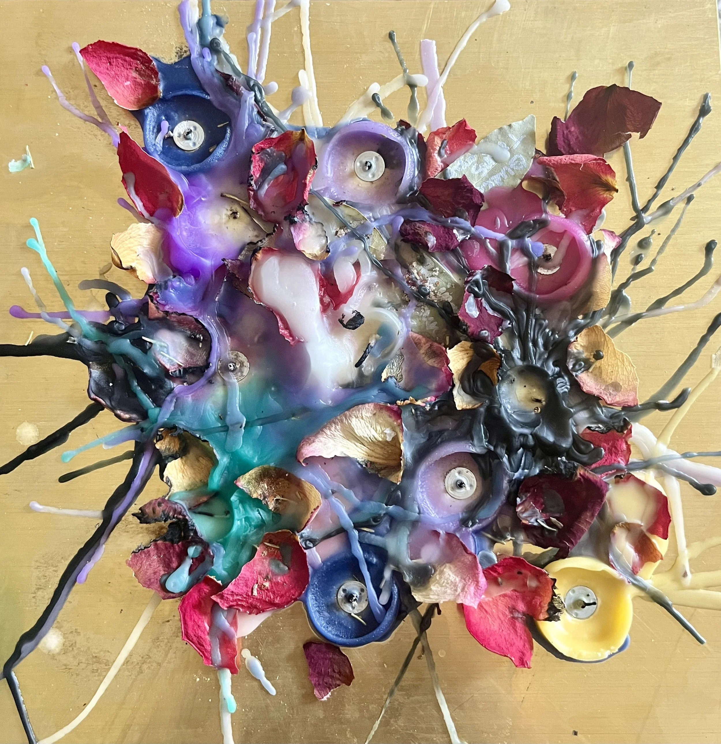 12x12 wax collage on brass 

My mixed media wax collages are called “Spell Collages” as they are each spells that direct energy towards community protection, healing, and liberation. I do not manipulate the wax with my hands but instead use words, in