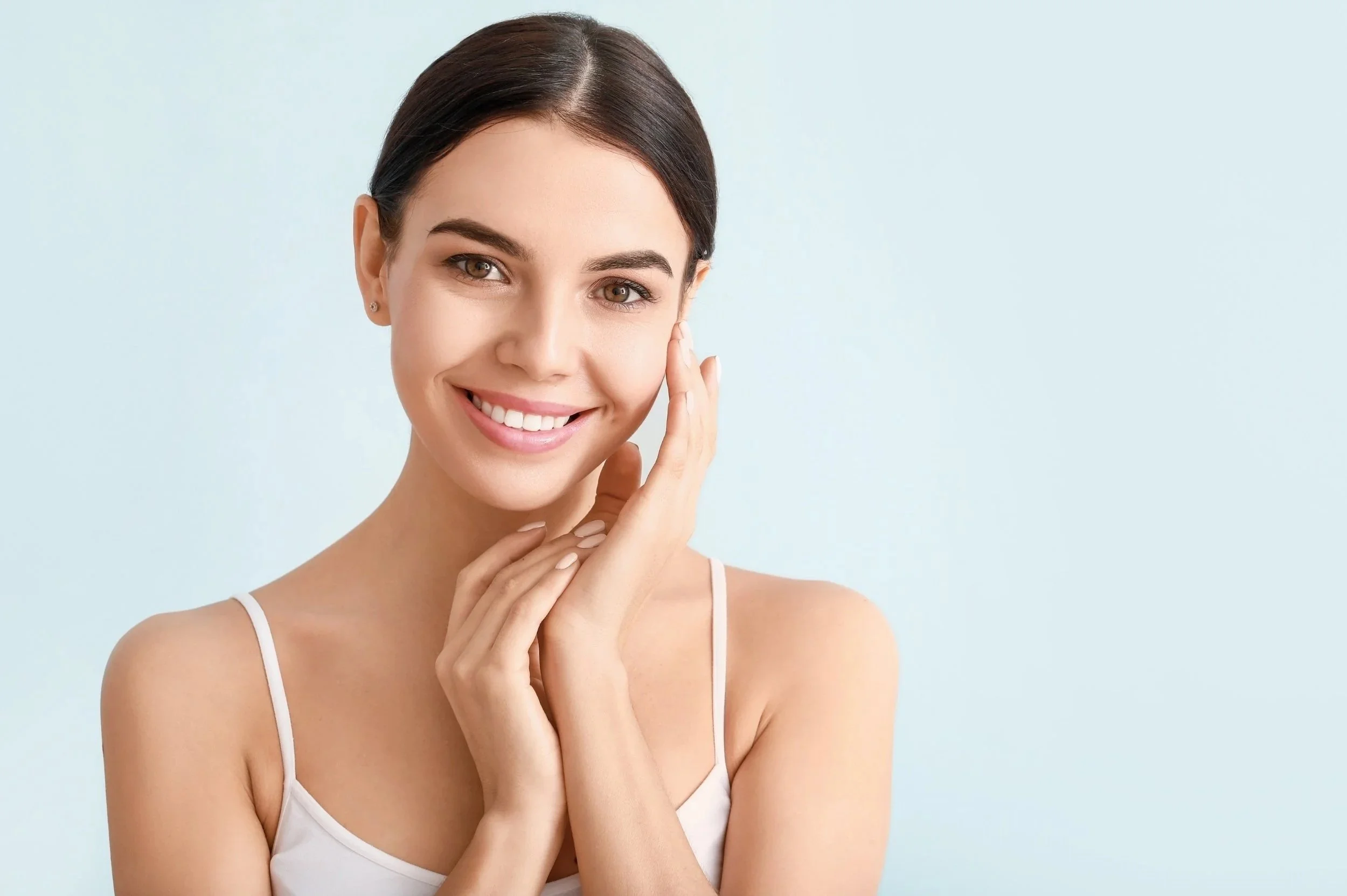 Woman with clean skin and glowing complexion aftr  holistic facial treatment at clean skincare studio in Sonoma County