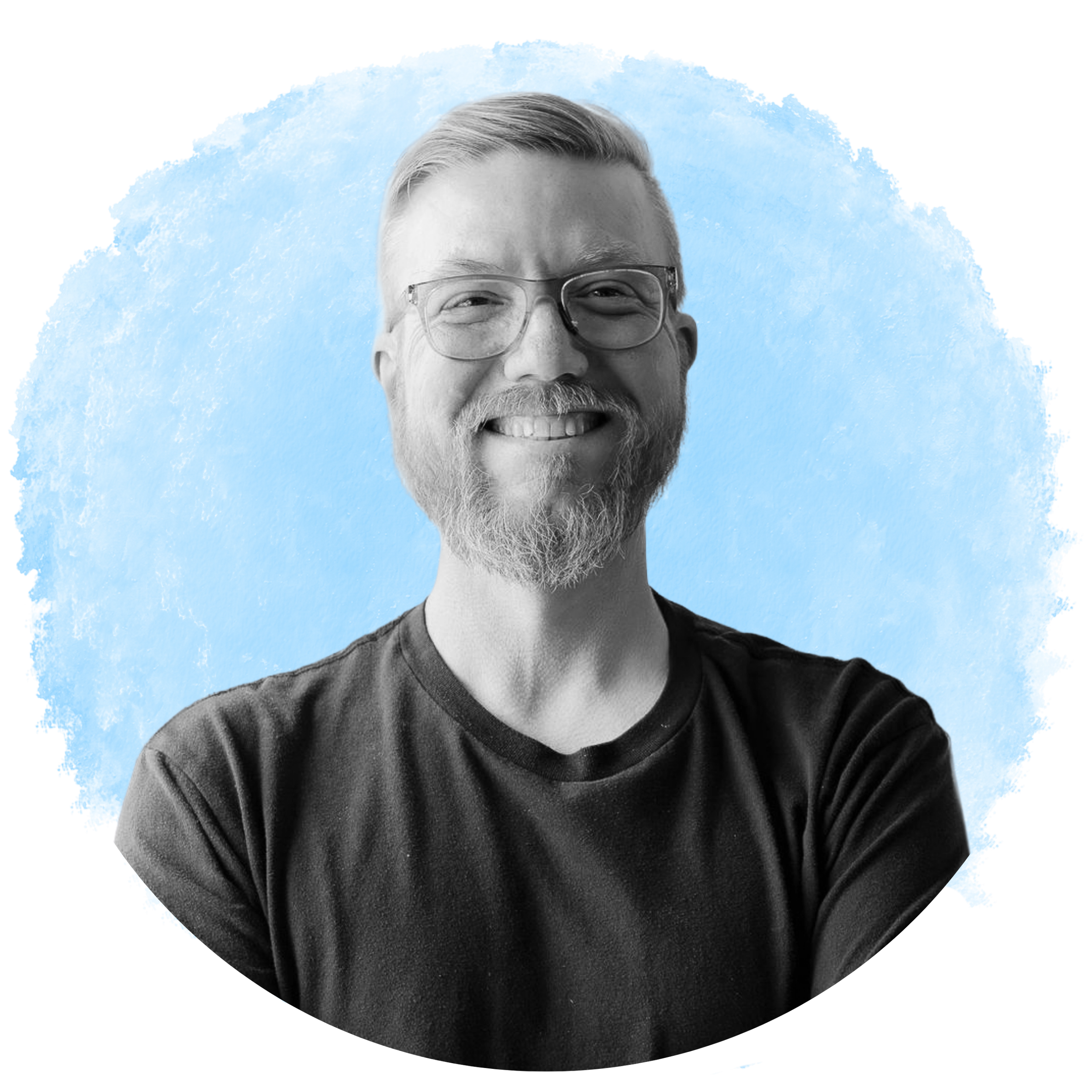 Black and white photo of a smiling man with glasses and a beard, wearing a dark shirt, against a blue background with digital distortion effects.