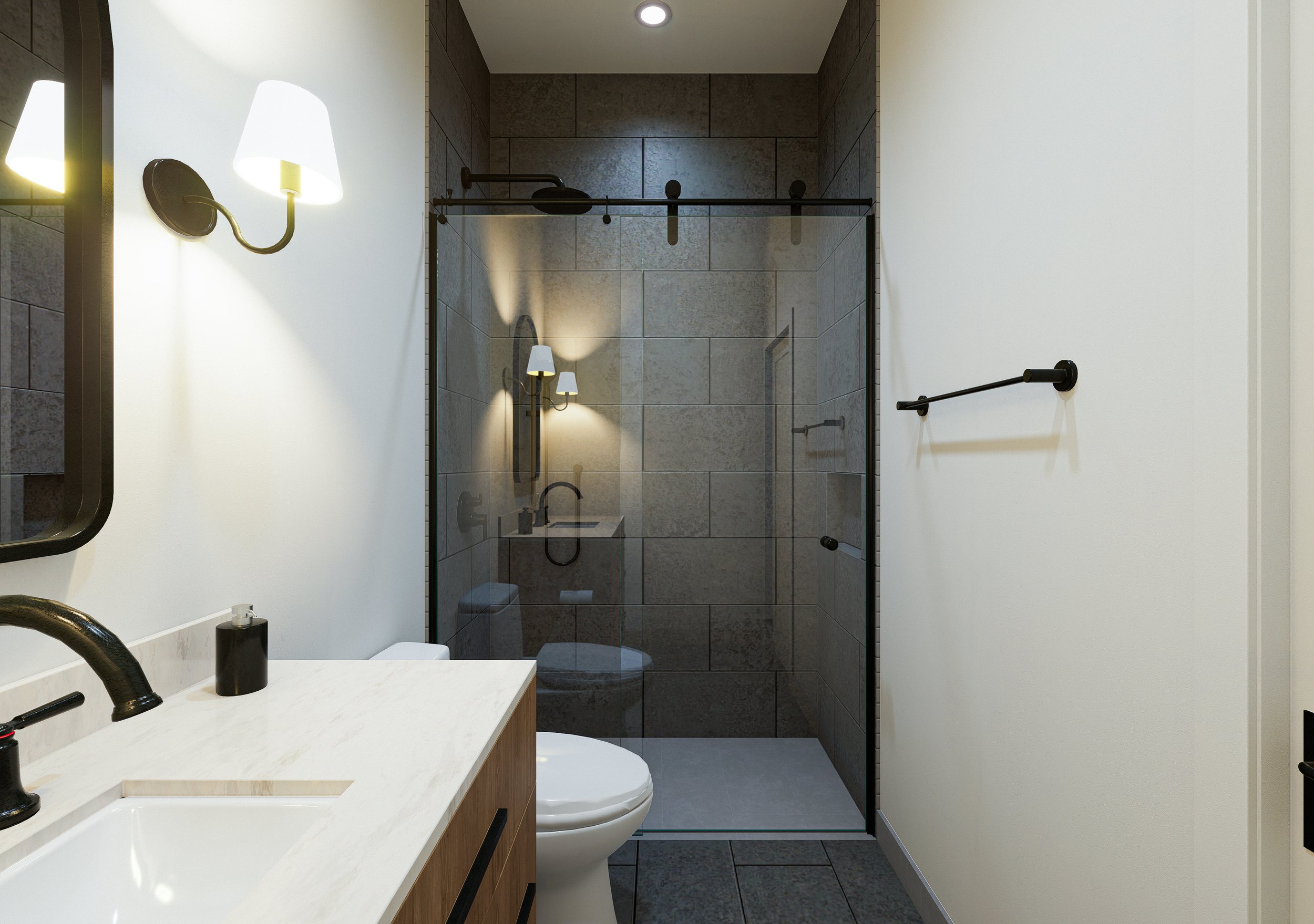 Modern bathroom with white vanity, black fixtures, a toilet, and a glass-enclosed shower with gray tile walls. Wall-mounted light fixtures illuminate the space.