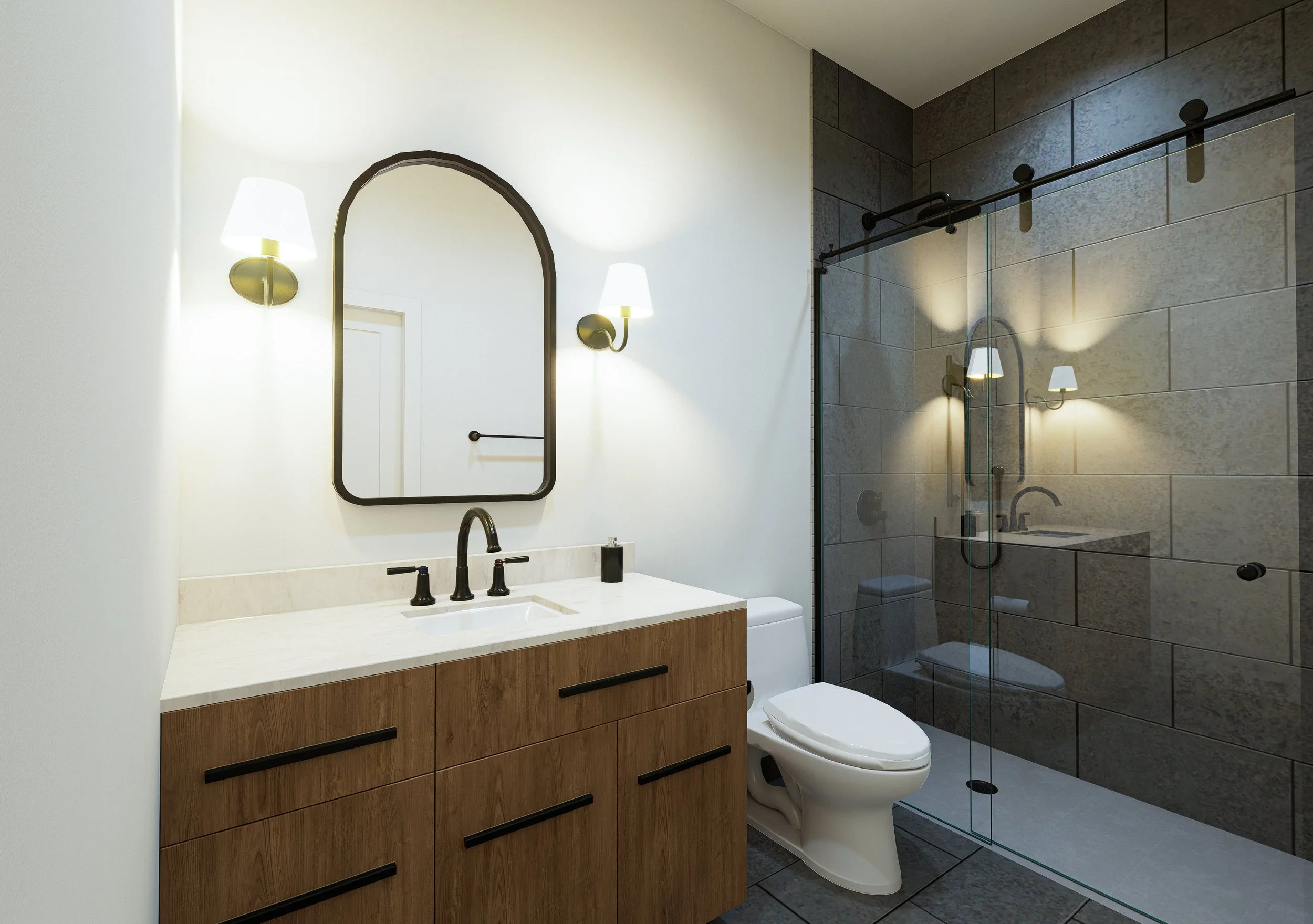 Modern bathroom with wall-mounted light fixtures, a large mirror, a wooden vanity with black handles, and a glass-enclosed shower with dark gray tiles.