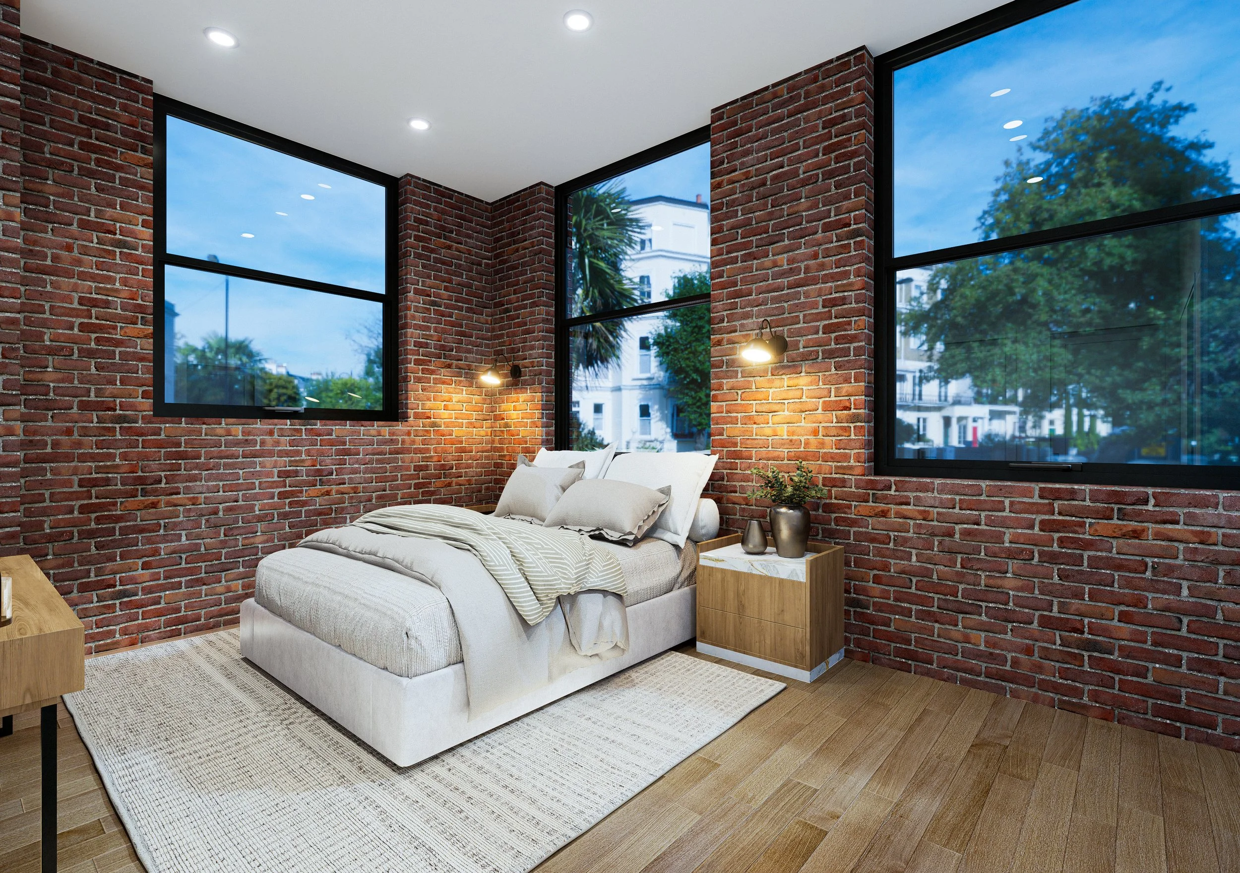 Bedroom with red brick walls, large windows showing trees and buildings outside, white bed with pillows, two wooden side tables, and a beige area rug.