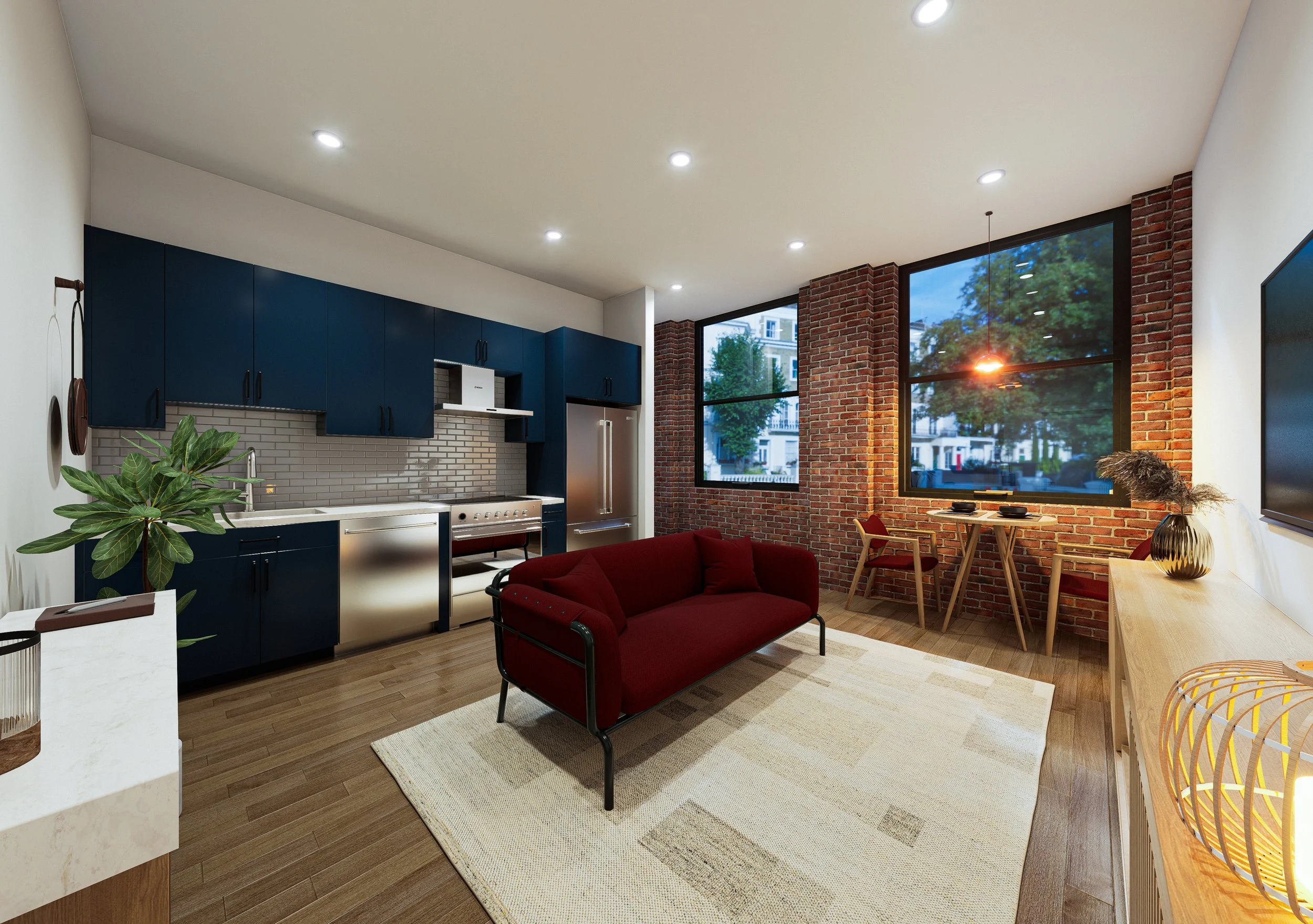 Interior of a modern apartment with a kitchen and living area, featuring brick walls, large windows with a view outside, a red sofa, a dining table with chairs, and decorative plants.
