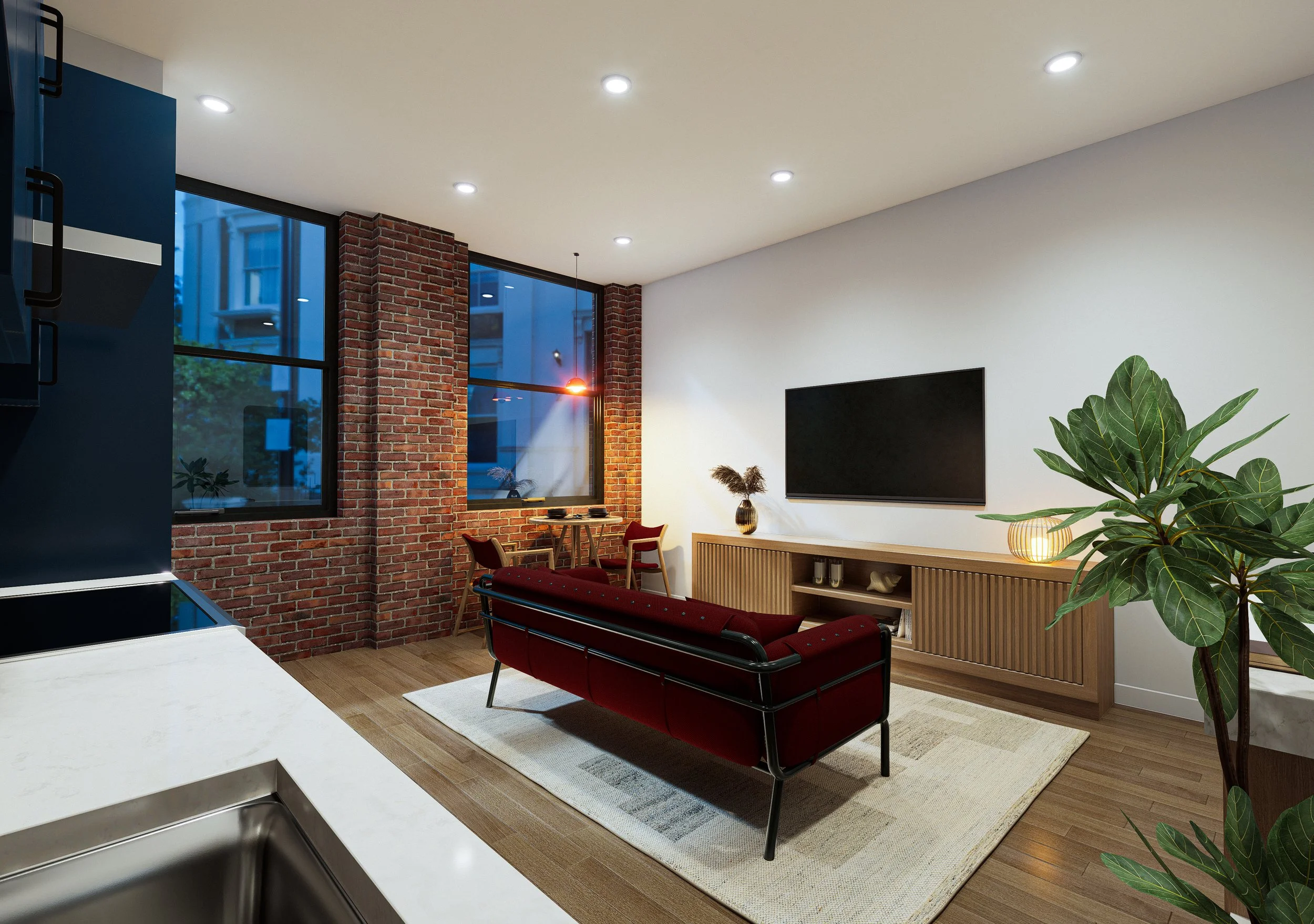 Modern living room with brick and white walls, large windows showing an urban setting, red armchair, wooden media console, flat-screen TV, indoor plants, and ceiling spotlights.