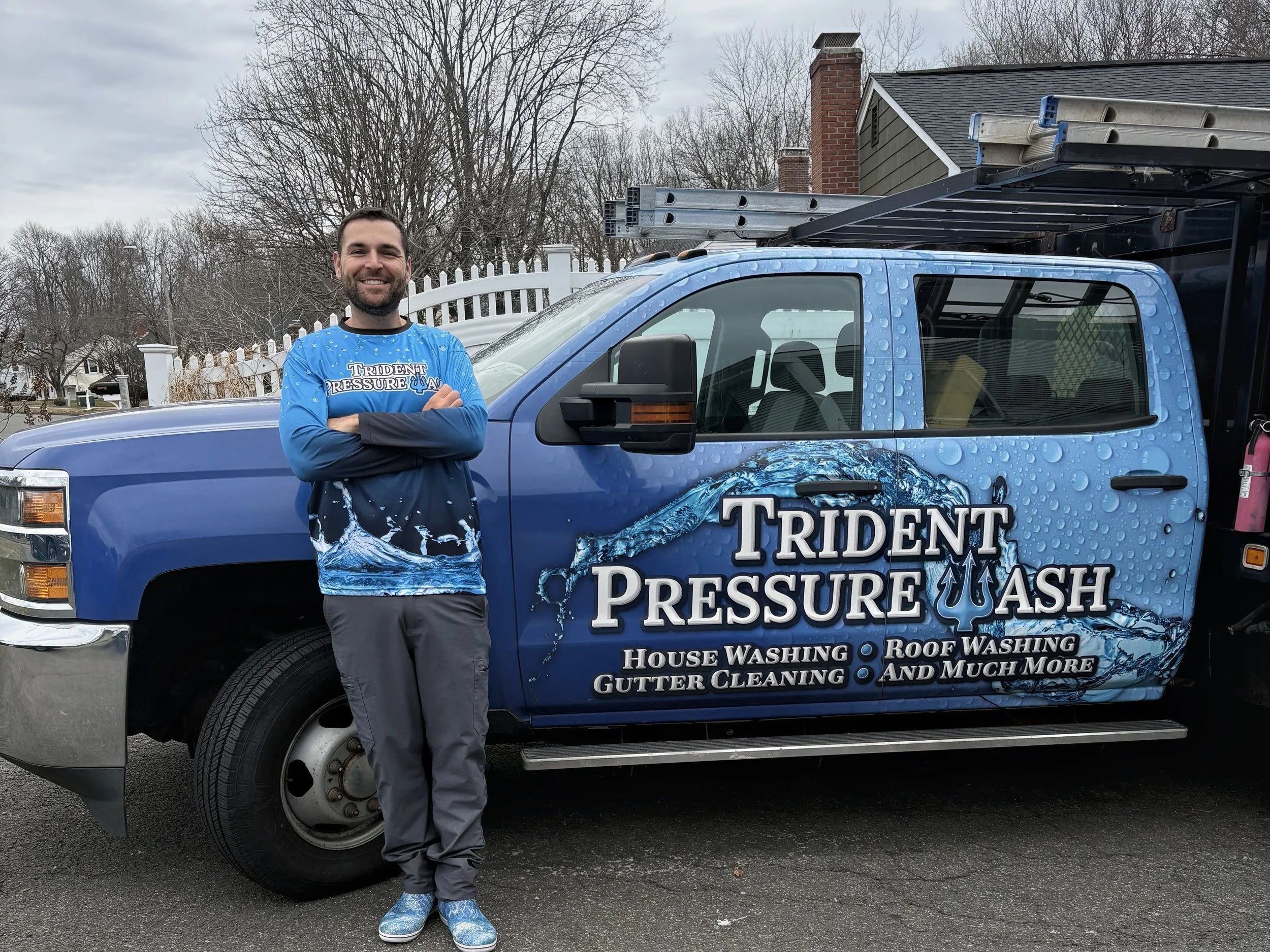 JJ Pabst Trident Pressure Wash owner standing in front of the blue work truck in a driveway in central Connecticut