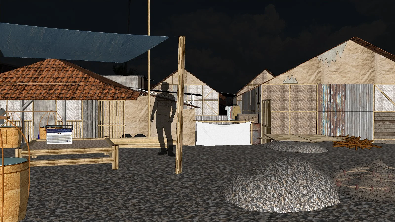 Nighttime scene of handmade houses with various construction materials, showing a person silhouette and furniture on a gravel ground.