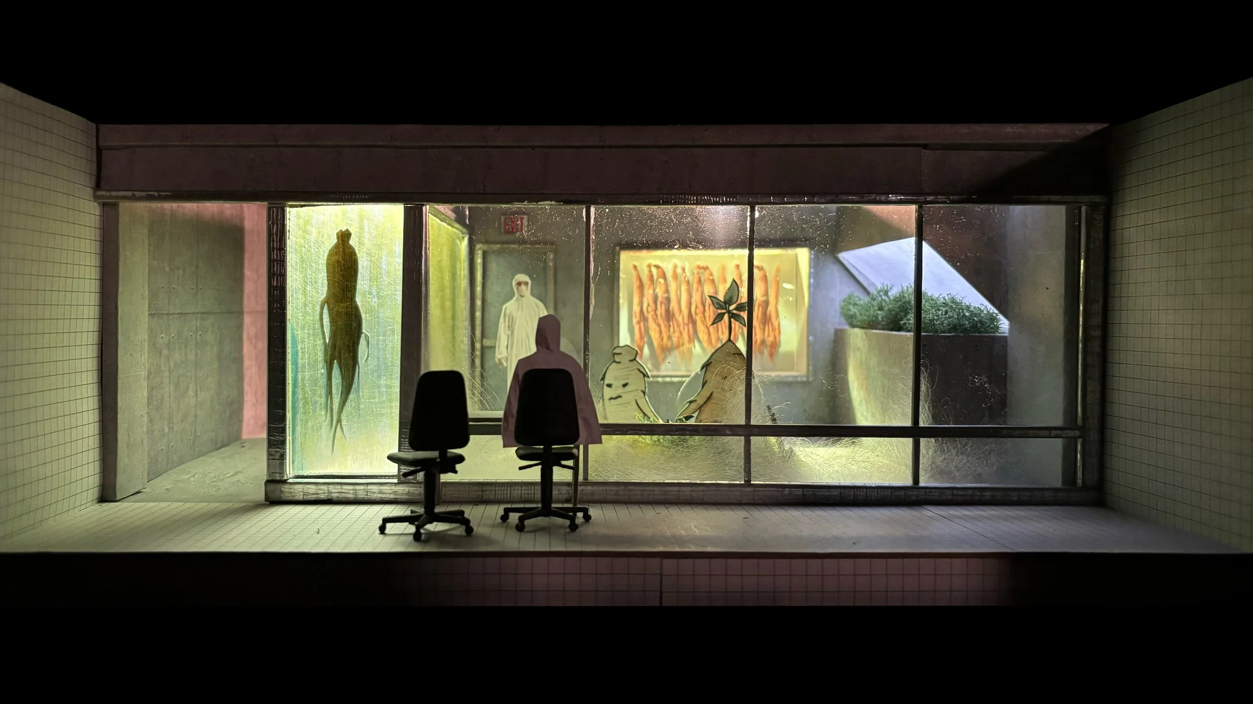 View through a foggy glass window showing interior art and chairs, with faint reflections of objects behind.