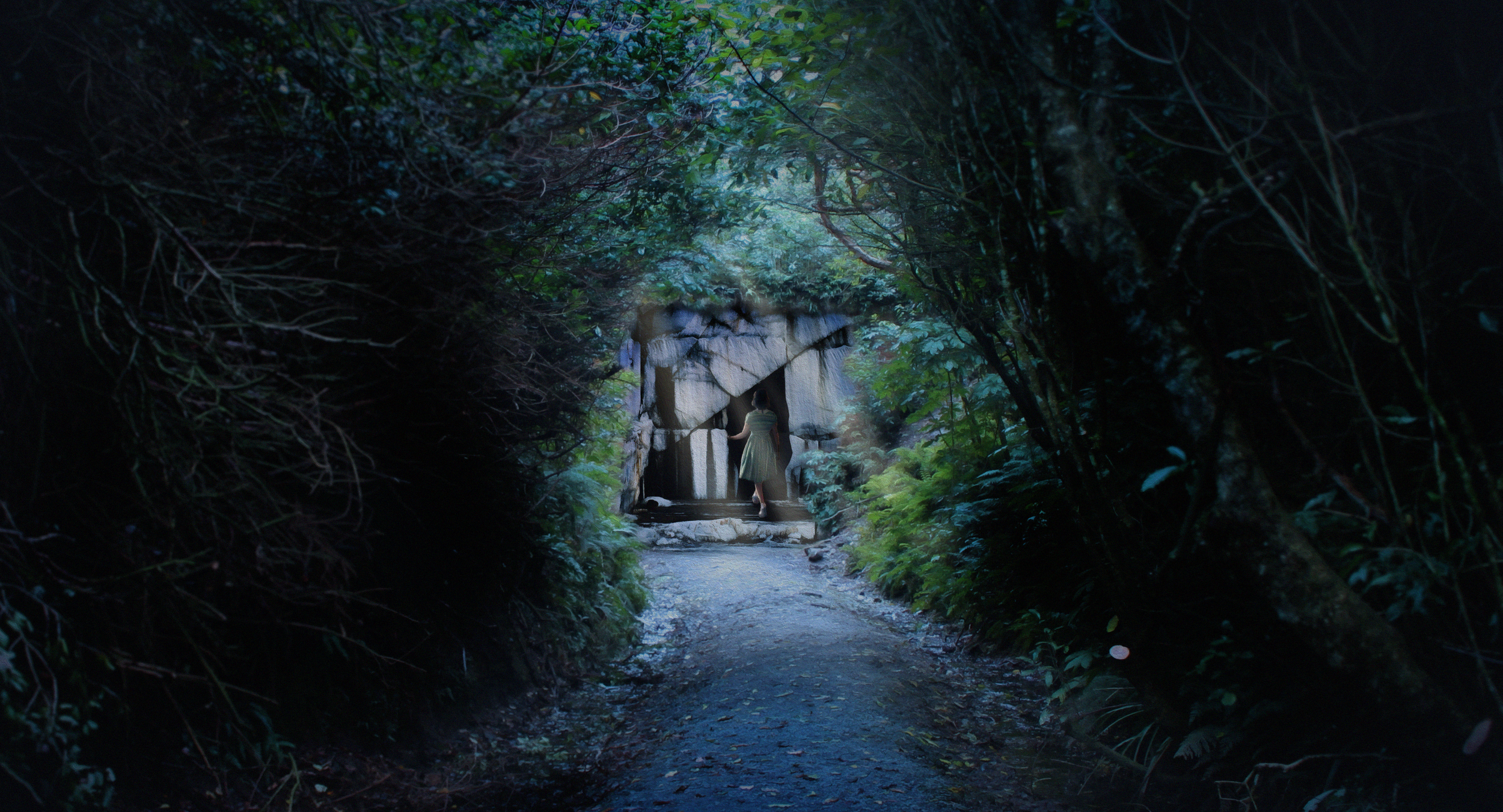 A woman in a light-colored dress walking through a dark, lush forest, approaching a small stone shrine or structure illuminated by natural light.
