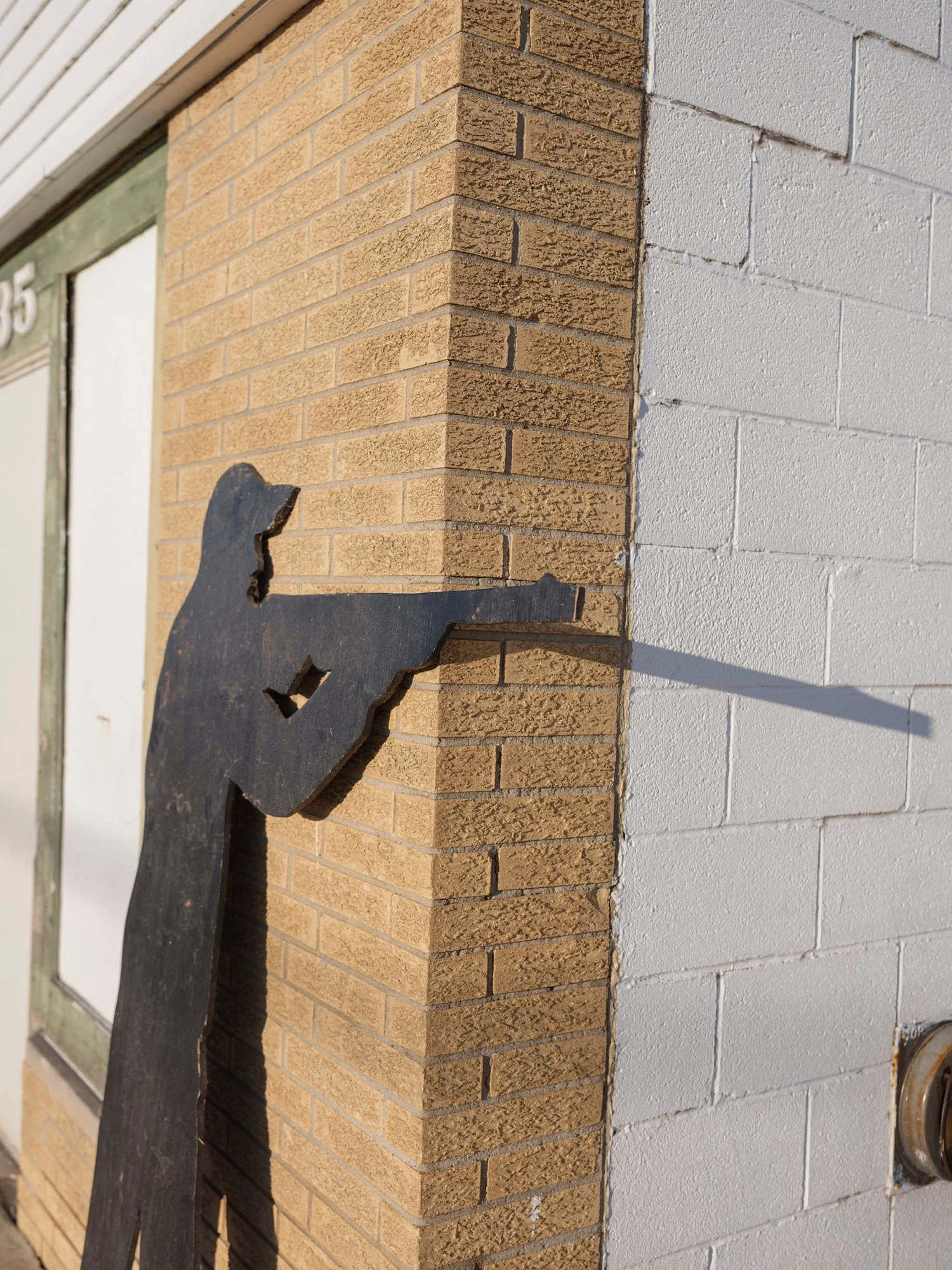 17- GuyHoldingWoodenGun copy 3.jpg