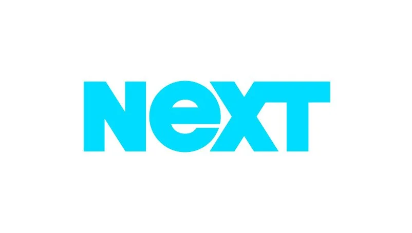Light blue text spelling "NEXT" on a white background.
