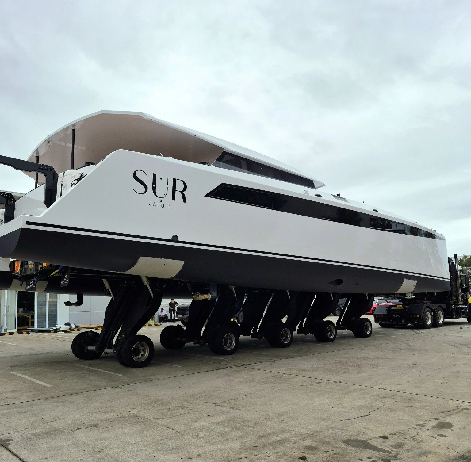 Side view of SUR | Jaluit carbon catamaran prepared for transport.