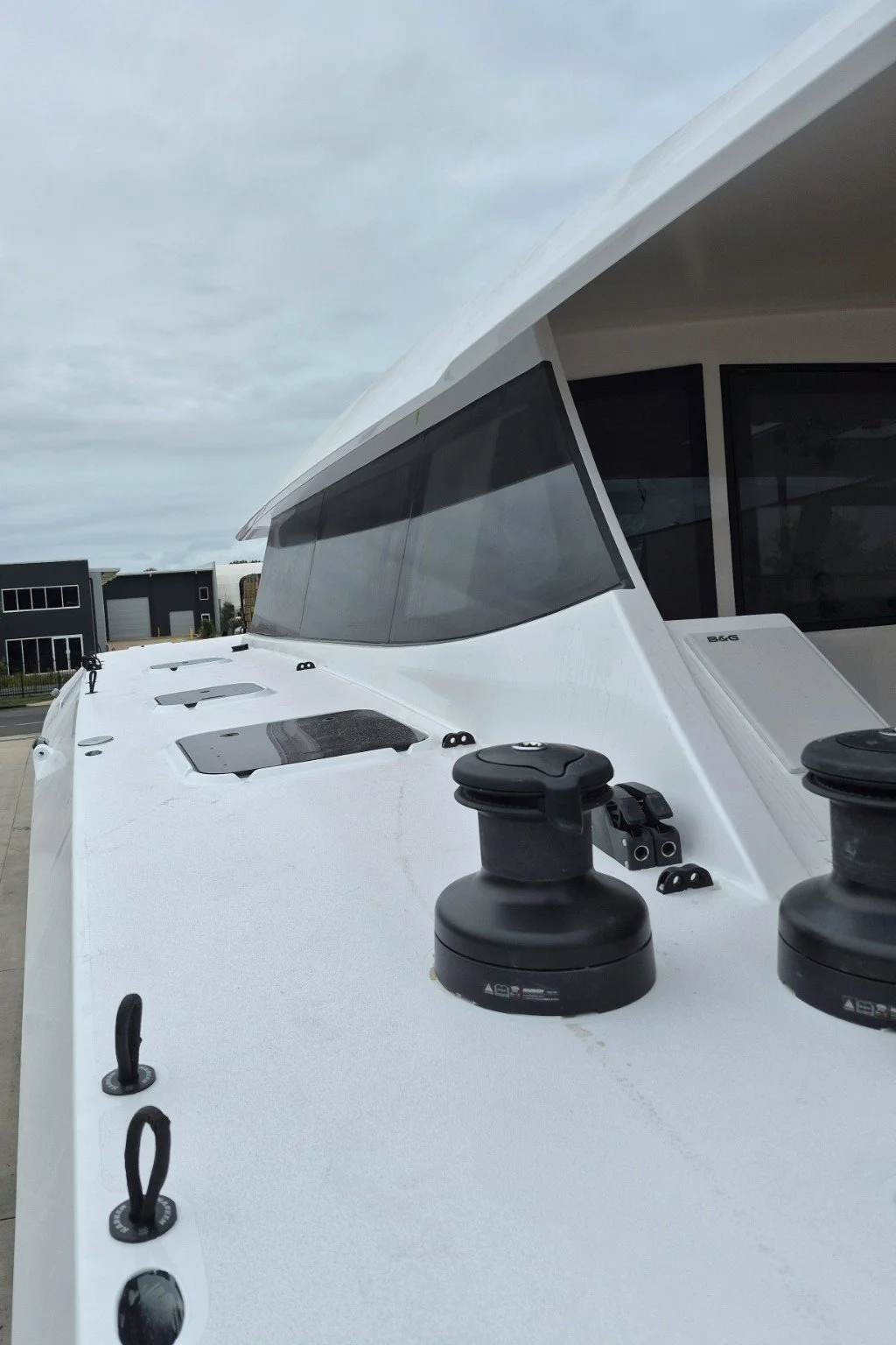 Catamaran deck, cabin windows and sailing hardware aboard SUR | Jaluit.