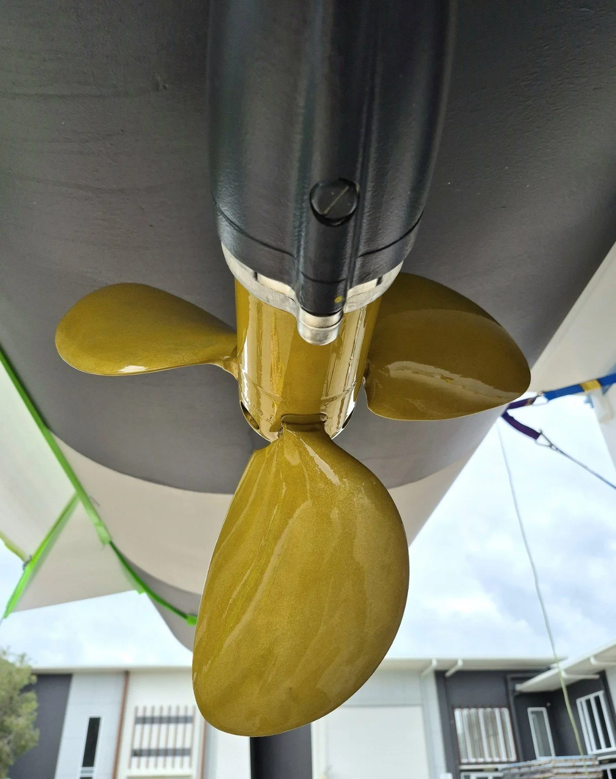 Gold-coated boat propeller and drive assembly.