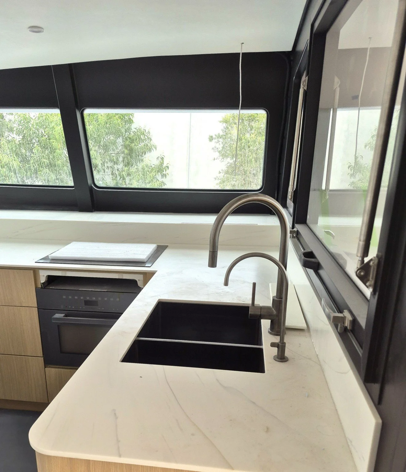 Galley cabinetry, benchtop and sink aboard SUR | Jaluit.