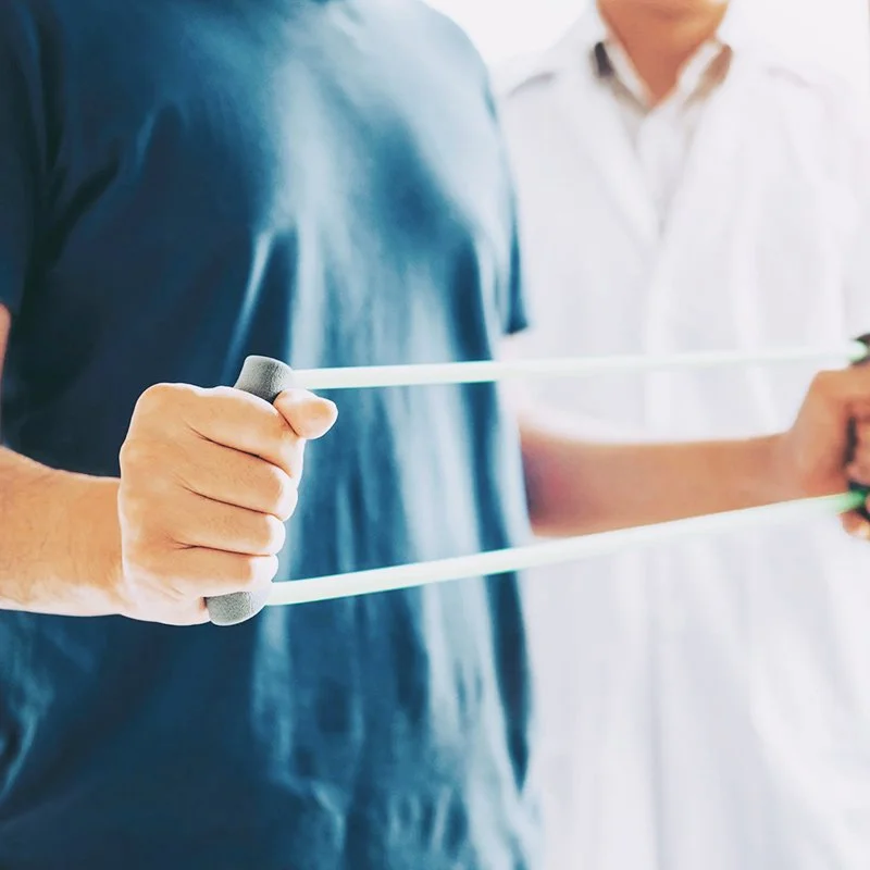 Man working with physical therapist in Redding, CA at Sensory Innovations