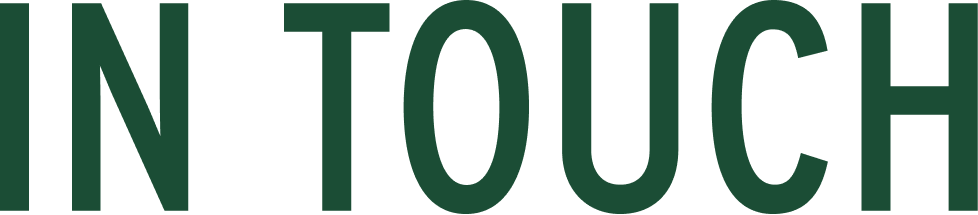 Close-up of green text on a black background that says 'N TOUCH'.