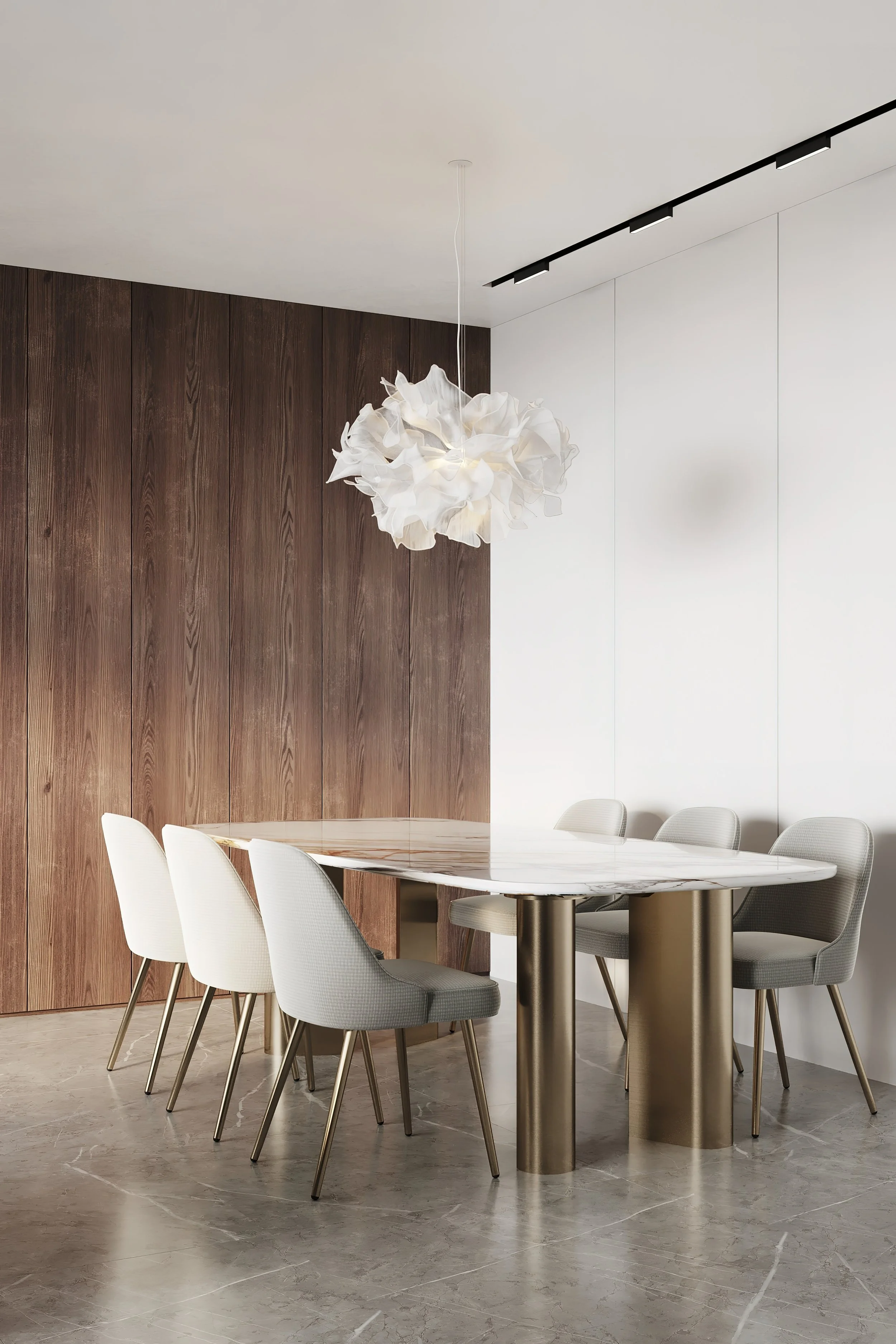 Modern dining room with a white oval table, six light-colored chairs, wooden wall panel, white wall, marble floor, and a sculptural white pendant light hanging from the ceiling.