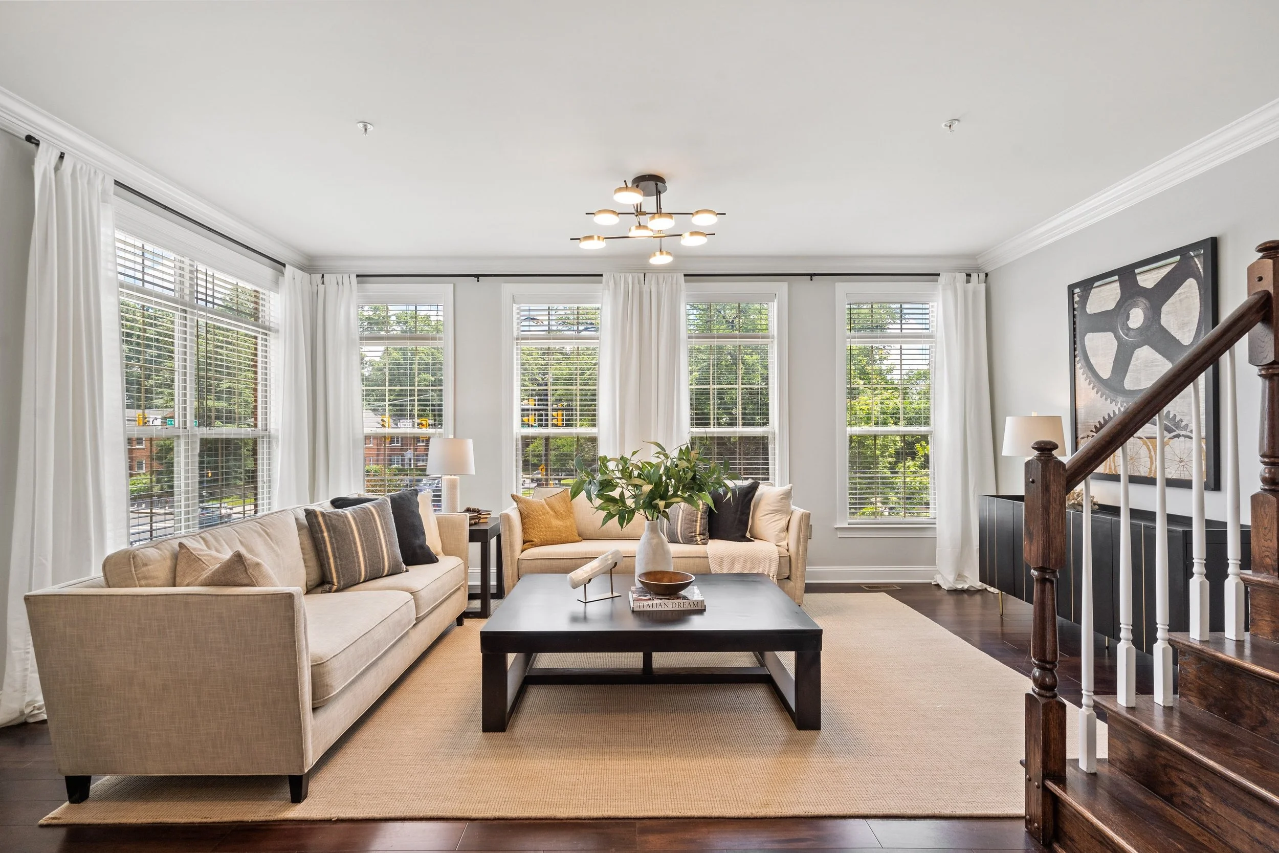Renata Briggmans staging transformation in Arlington, VA after photo of the living room and kitchen.