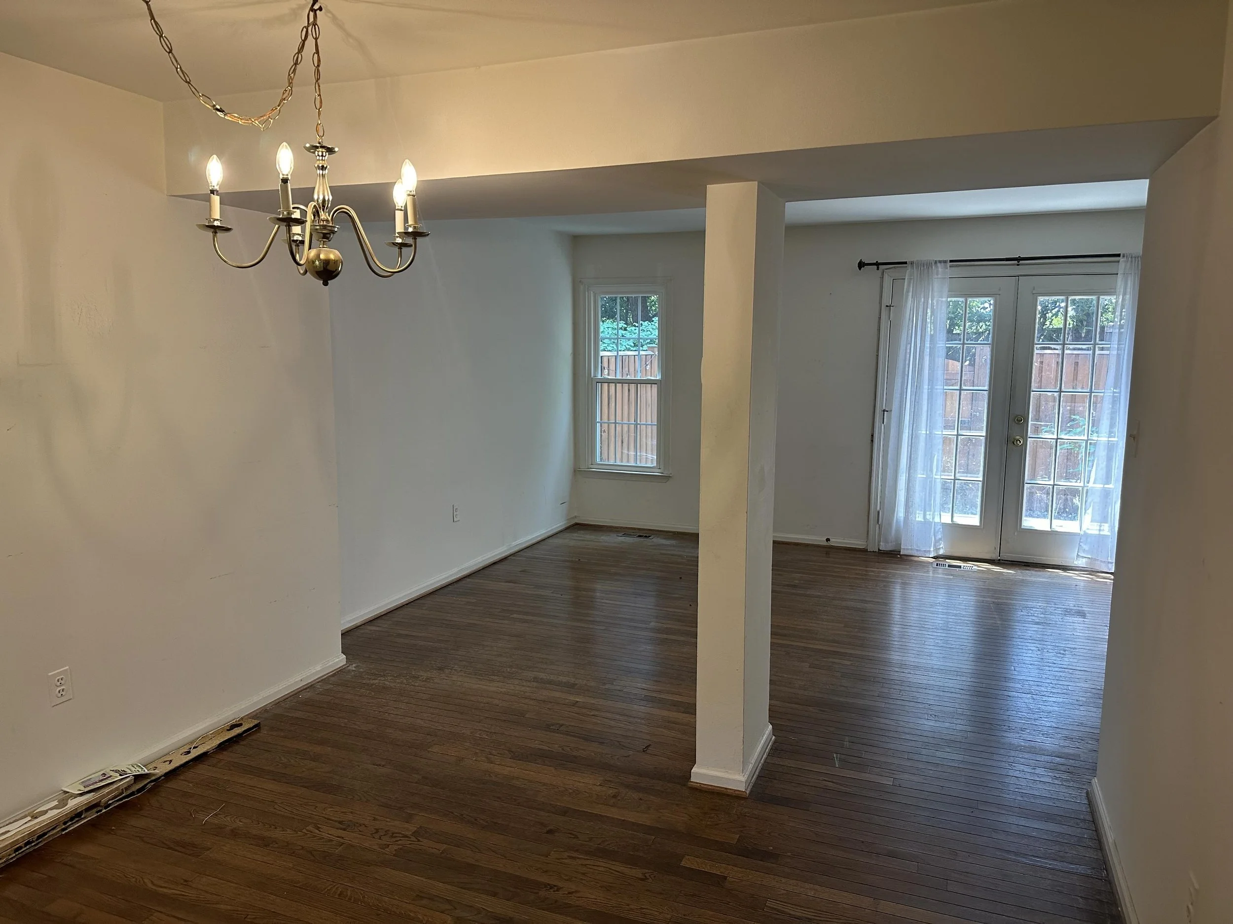 Renata Briggmans staging transformation in Arlington, VA  before photo of the living room and dining room.