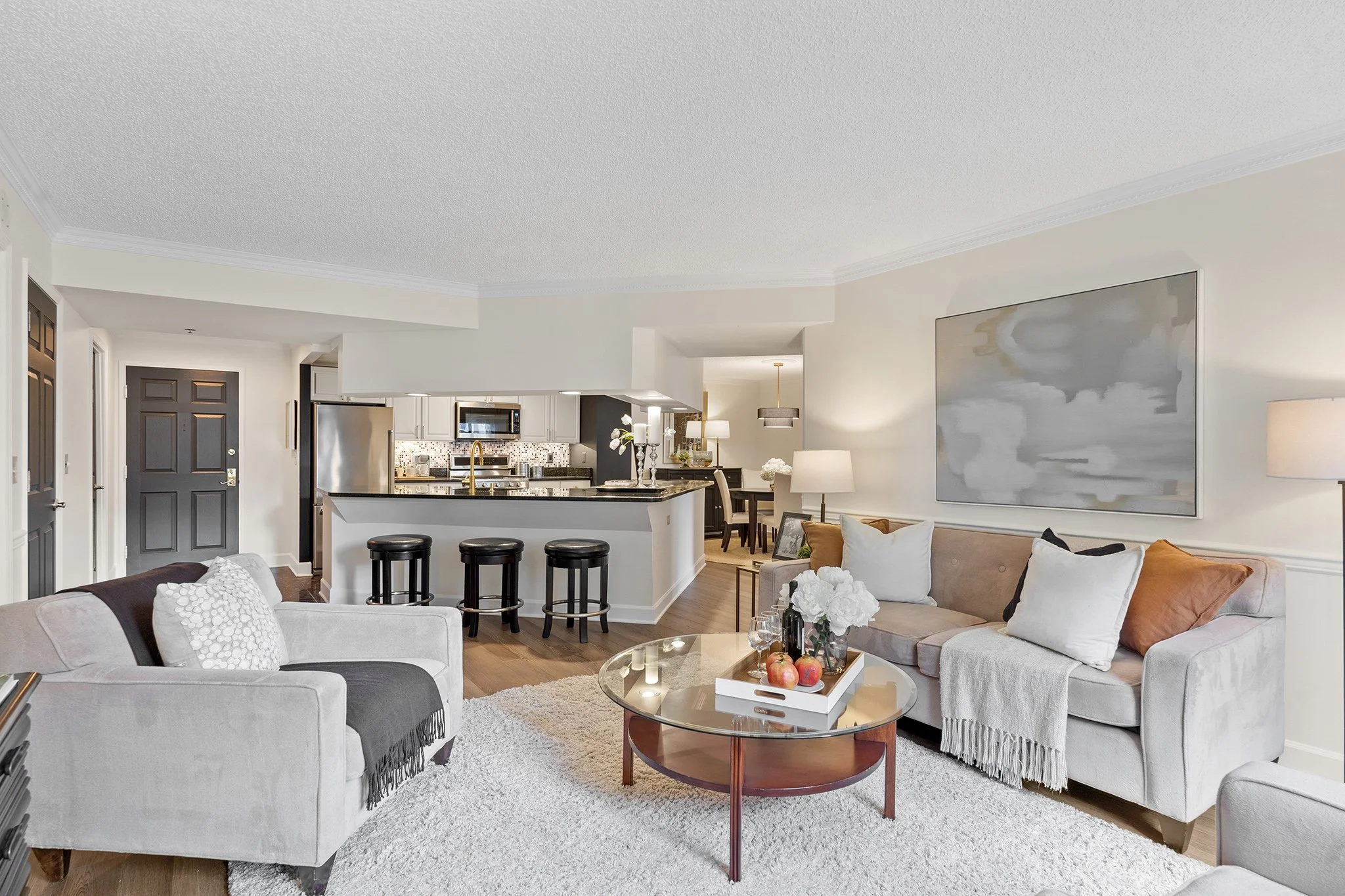 Renata Briggman's staging transformation in Arlington, VA after photo of the living room and kitchen.