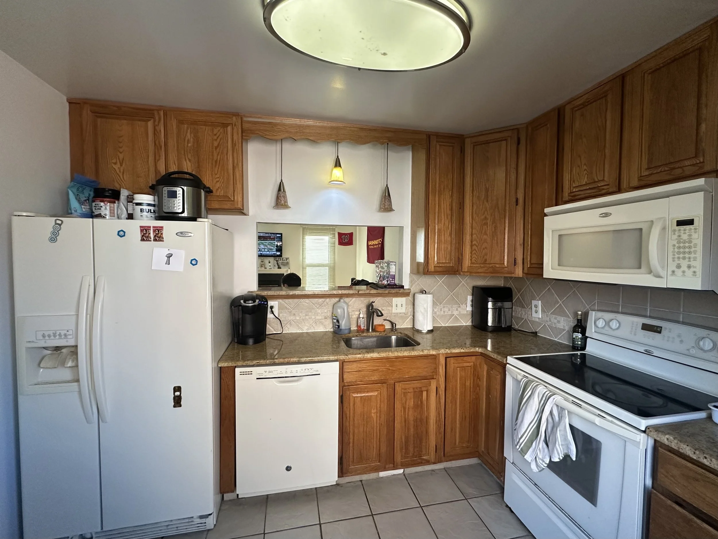 Renata Briggman's staging transformation in Arlington, VA before photo of the kitchen.