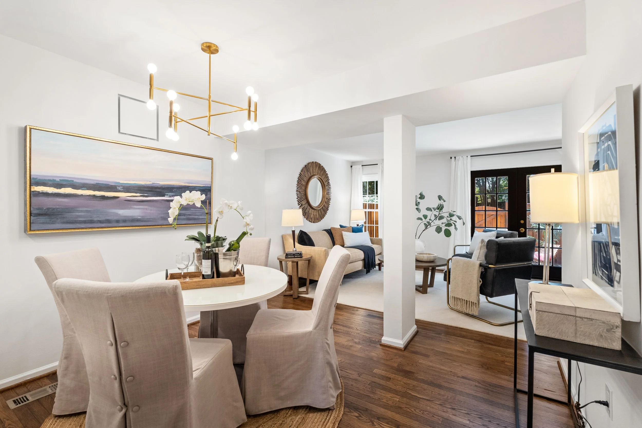 Renata Briggmans staging transformation in Arlington, VA after photo of the living room and dining room.