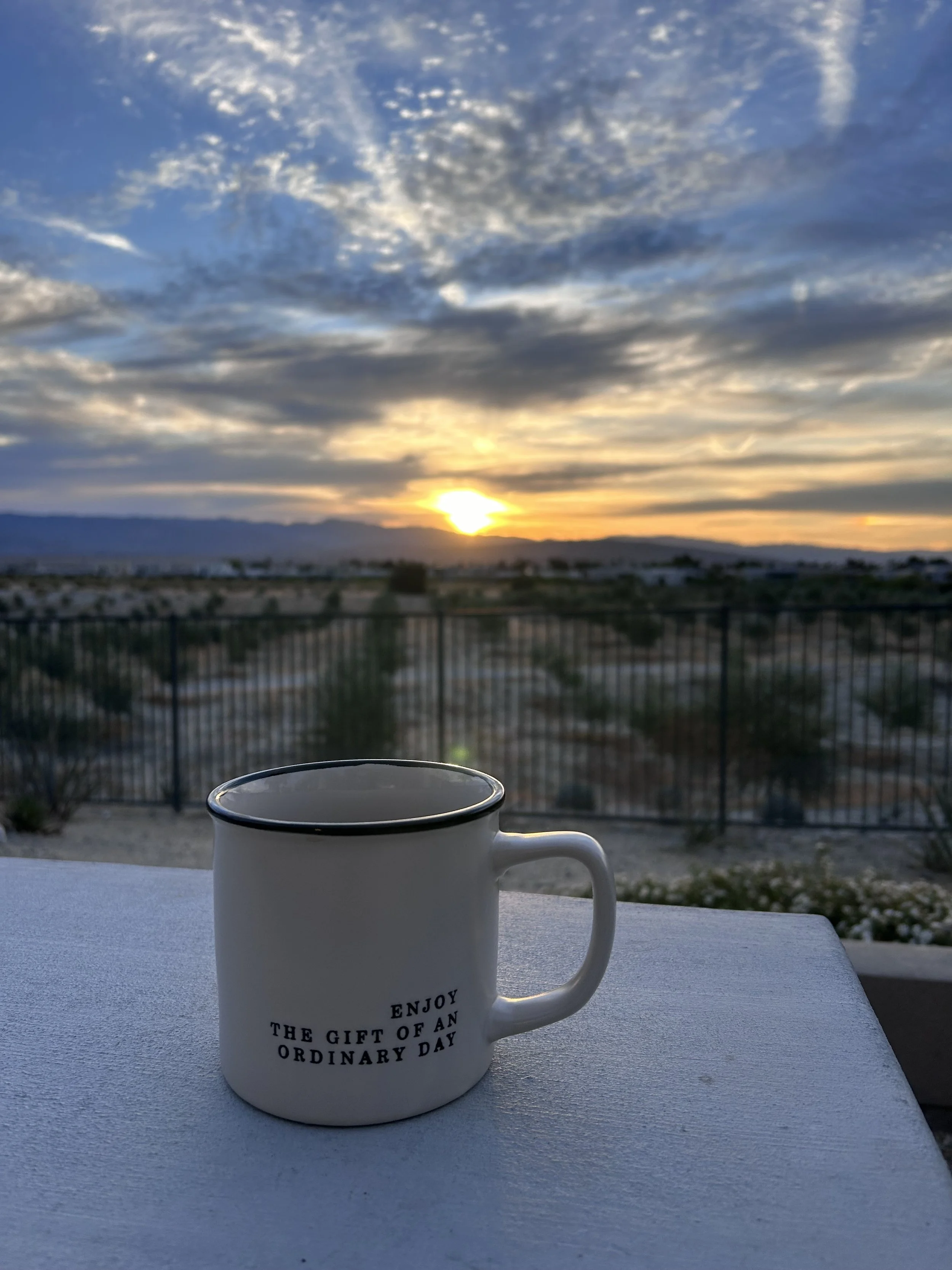 Coffee cup and sunrise