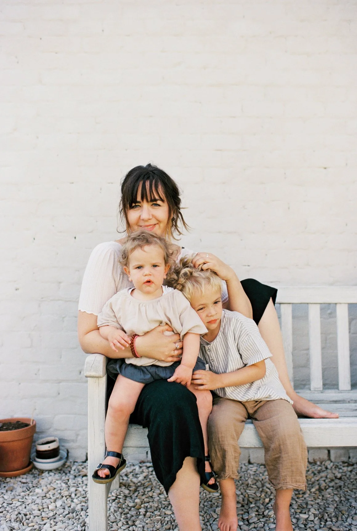 a woman with her two children waits for a psychological assessment in Maryland