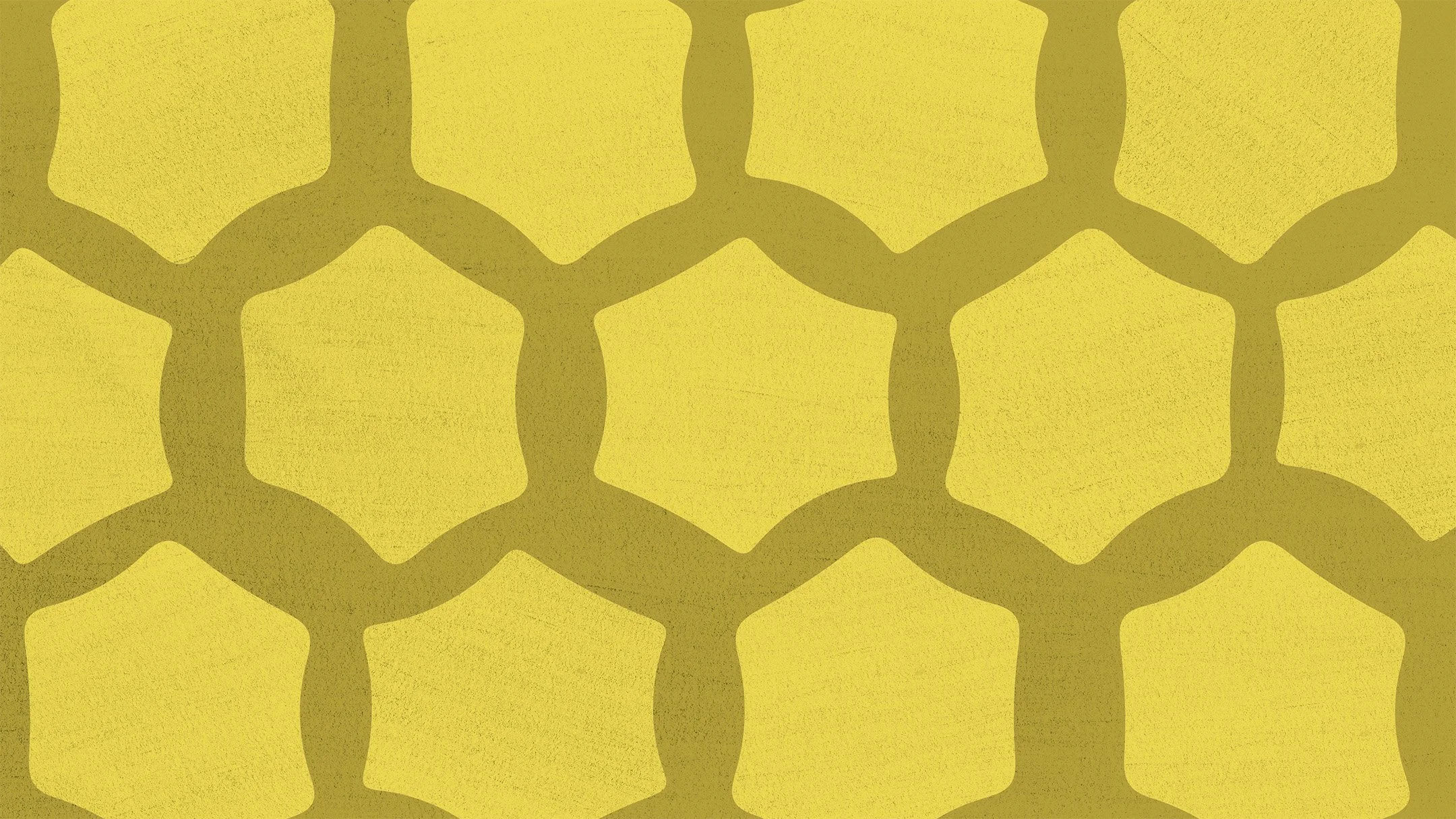 Close-up of a yellow honeycomb structure with dark outlines.