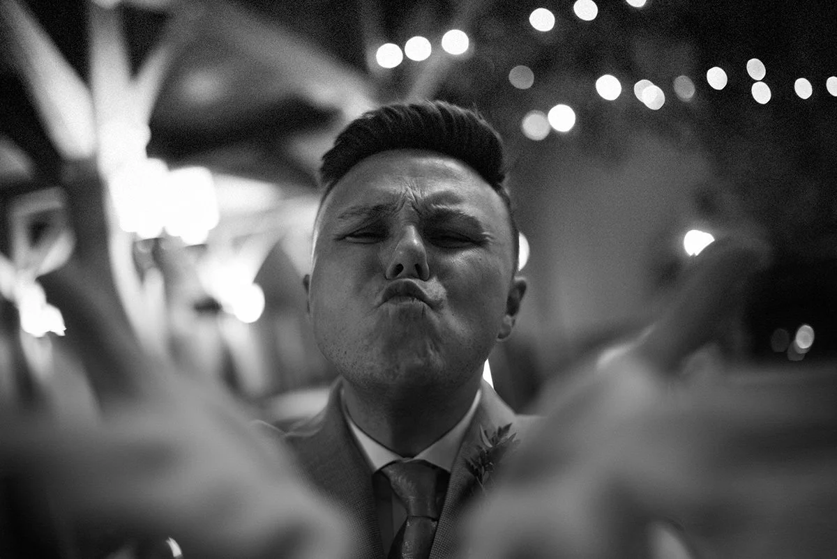 Playful candid image of a wedding guest