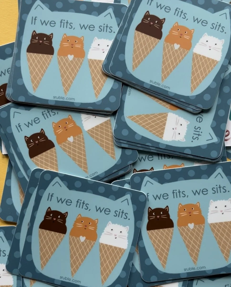 a pile of stickers with three cats (brown, orange, white) sitting in ice cream cones, with text: "If we fits, we sits." on a background shape of a cat's head in aqua, on a dark teal square with light polka dots