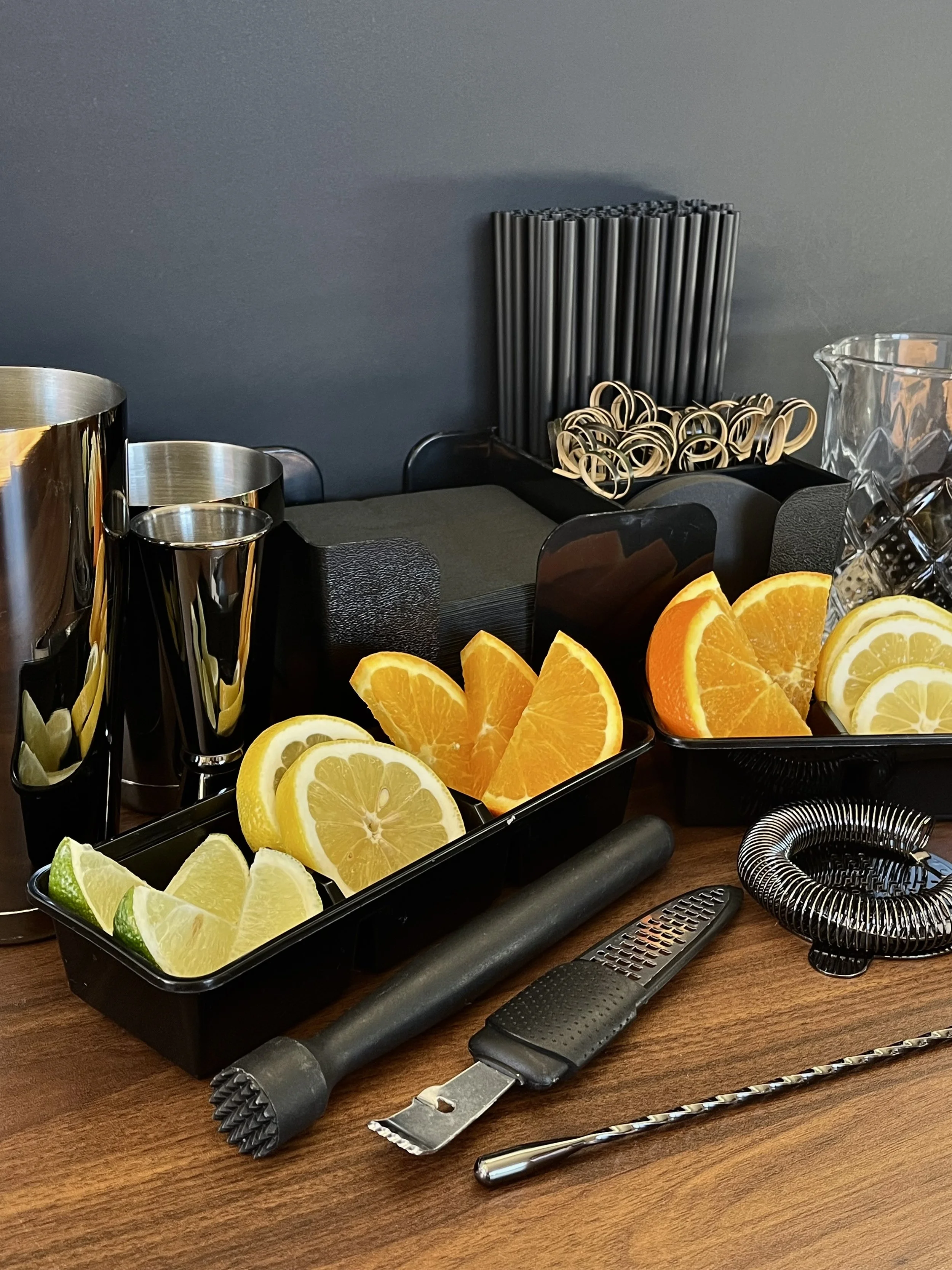 Bar tools and fruit garnishes for private bartending.