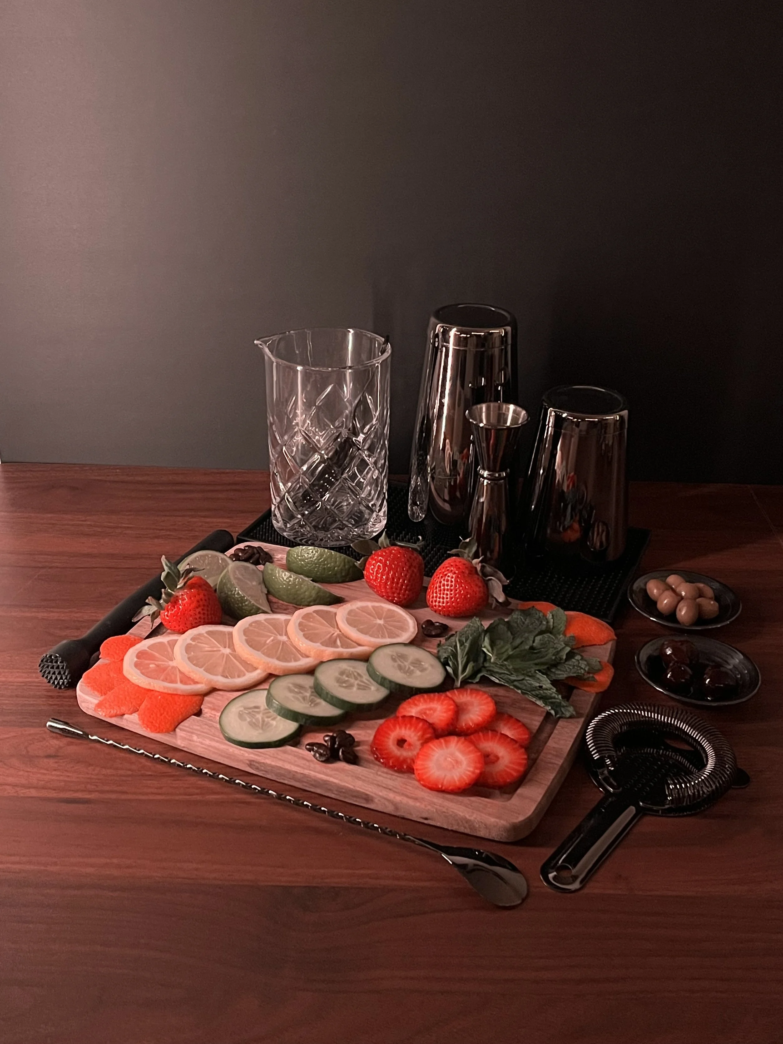 Fruit garnishes for mocktails and cocktails with bar tools for mixology classes or for private bartending