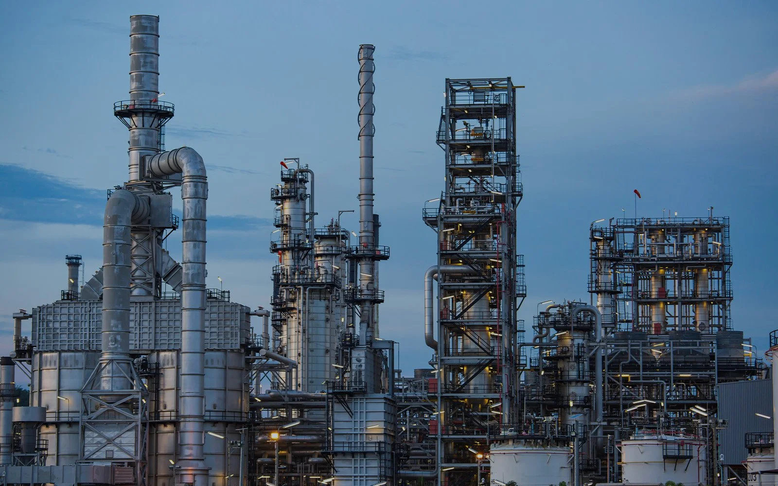Refinery facility with industrial process towers used in plant operations