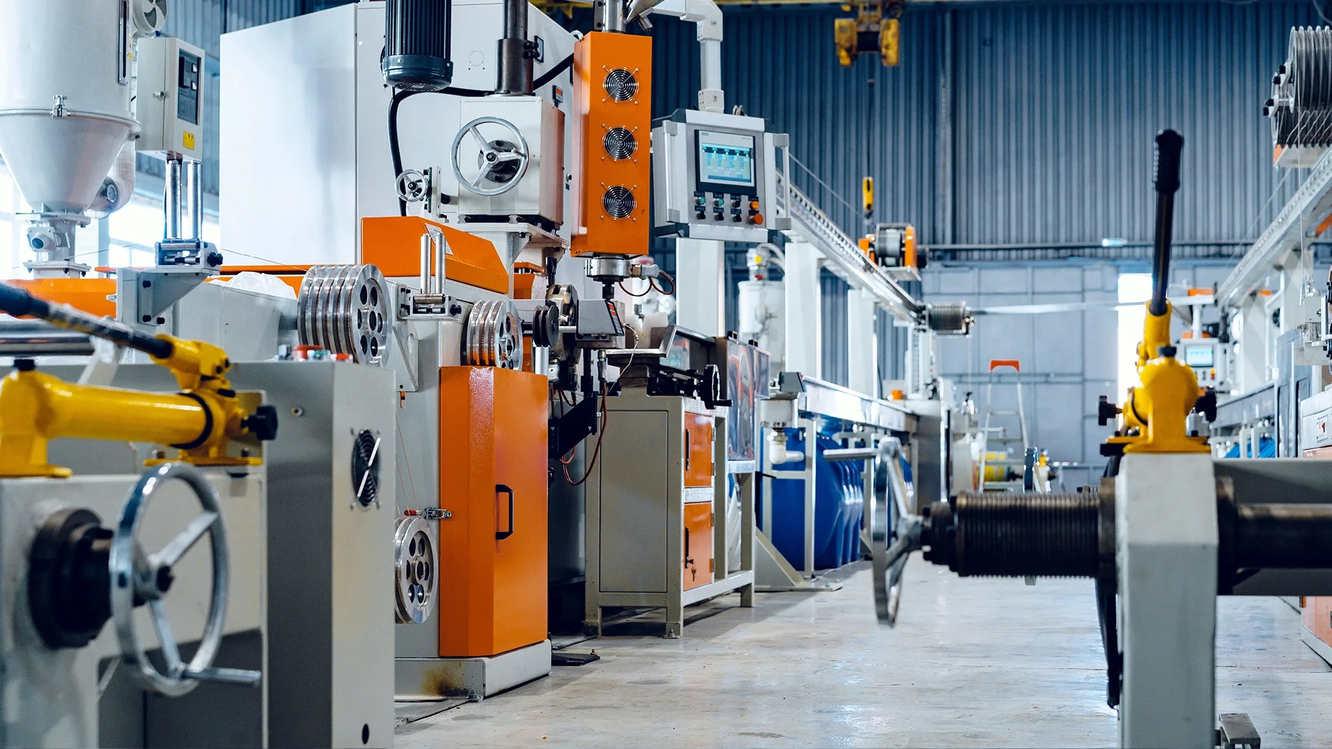 Industrial equipment manufacturing factory floor with production machines and process equipment